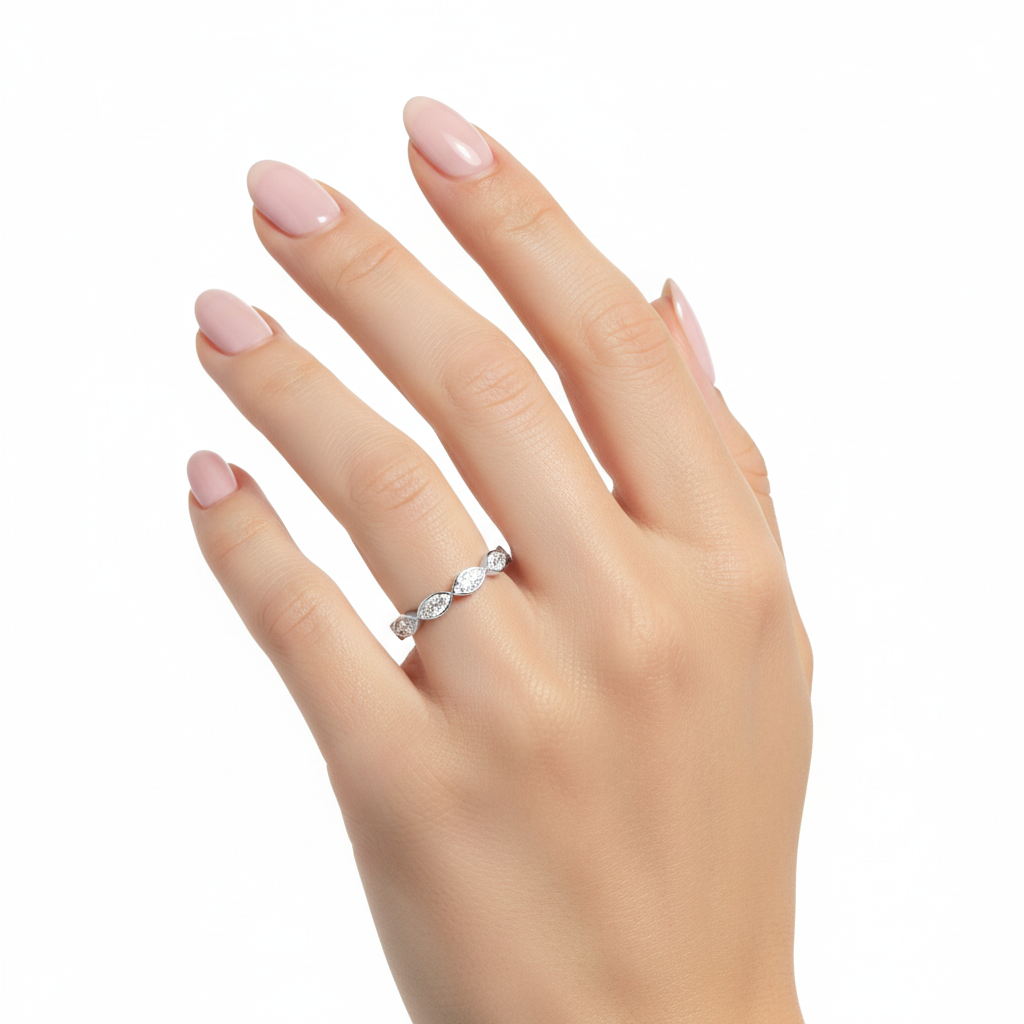 Close-up of marquise diamonds in bezel setting on hand model