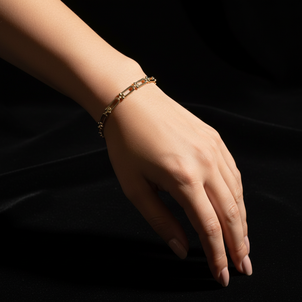 Modern 14K gold bracelet featuring elongated paperclip link