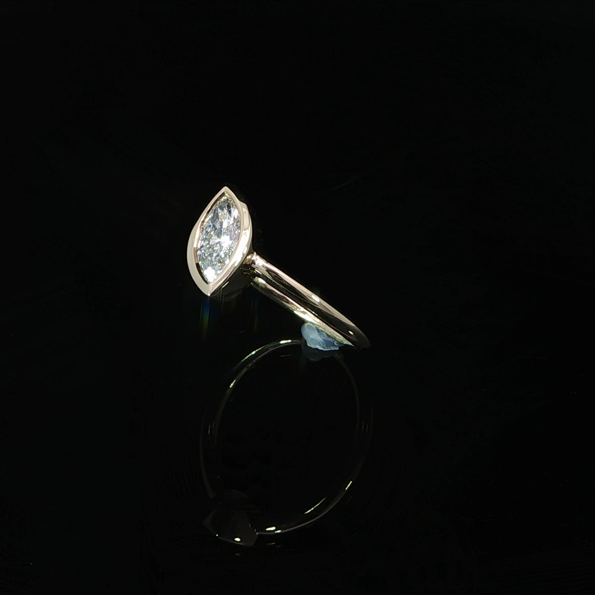 0.73 CTW lab grown diamond engagement ring with a marquise center stone in 14K yellow gold.