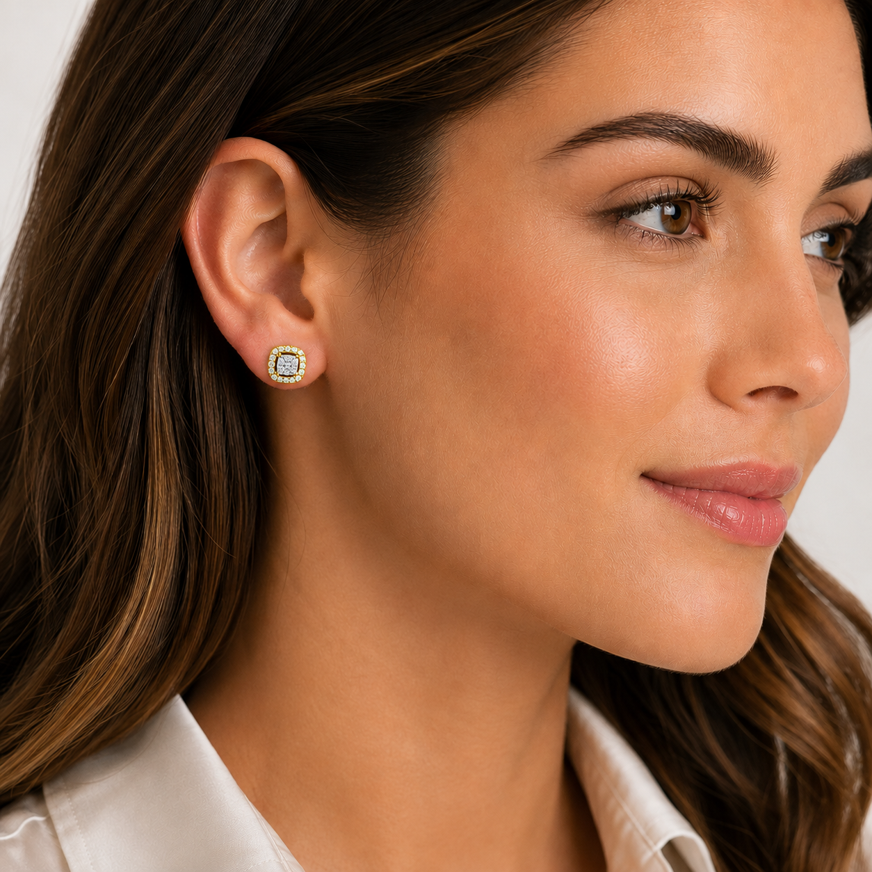 Model wearing 0.26 CTW natural diamond stud earrings crafted in yellow gold