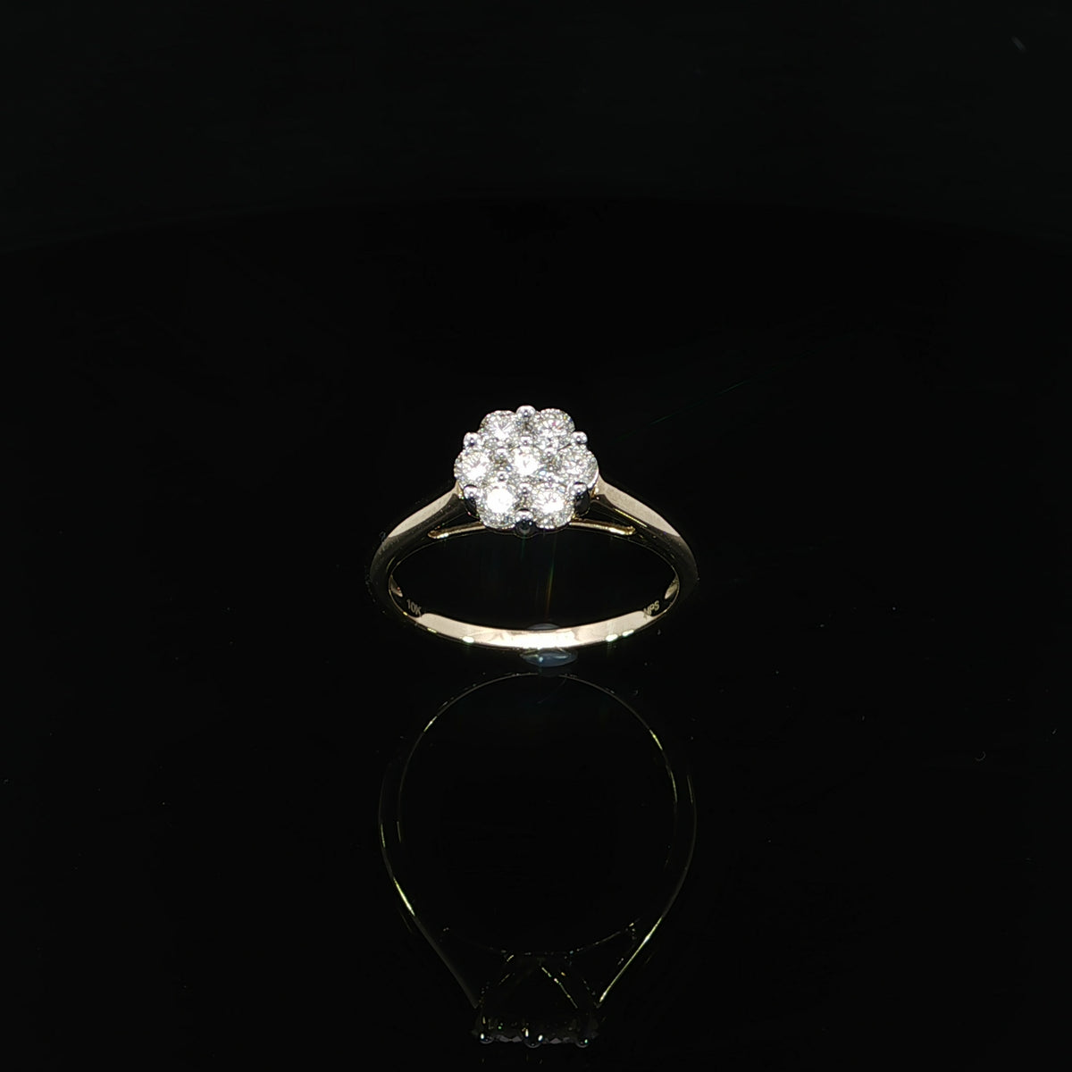 Front view of a 0.50 CTW seven-stone diamond ring in 10K yellow gold showing the scalloped cluster outline.