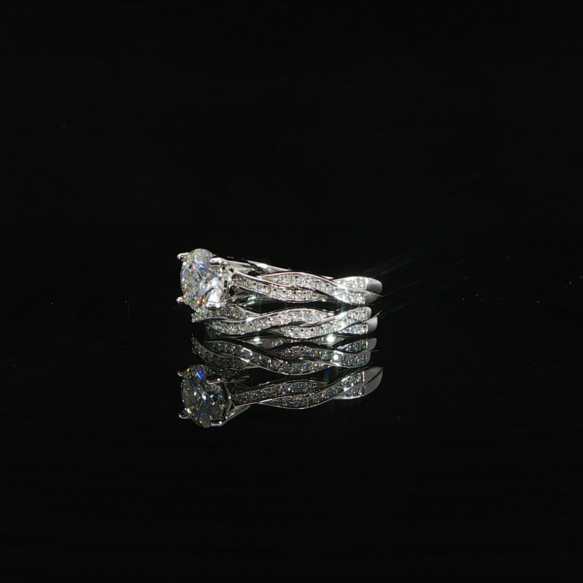 925 sterling silver twisted pavé wedding ring set with round VVS moissanite