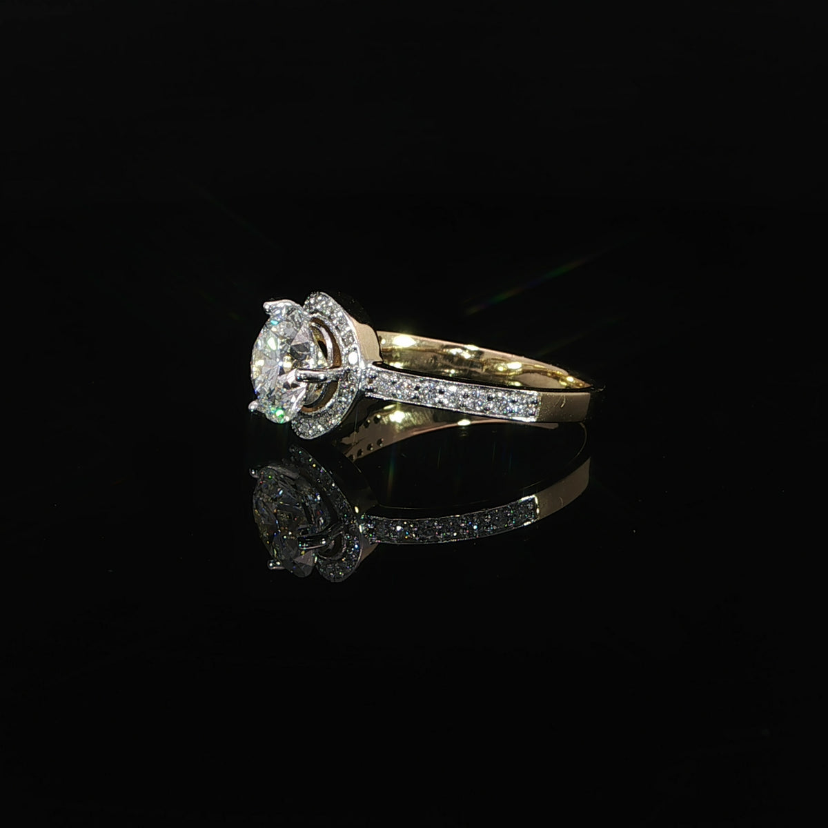 14K yellow gold bypass engagement ring with a 1.51 carat round lab grown diamond and pavé diamond accents.