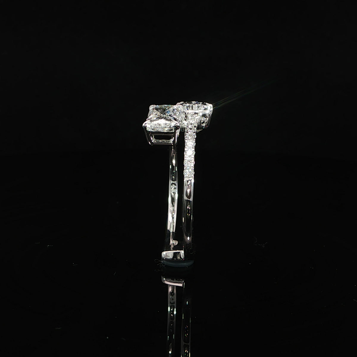1.52 CTW Toi et Moi diamond ring featuring radiant and pear shaped lab grown diamonds.