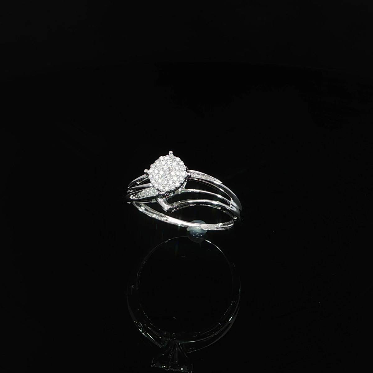 Angled view of a 10K gold 0.07 CTW round pavé composite ring with open, sweeping shoulders.