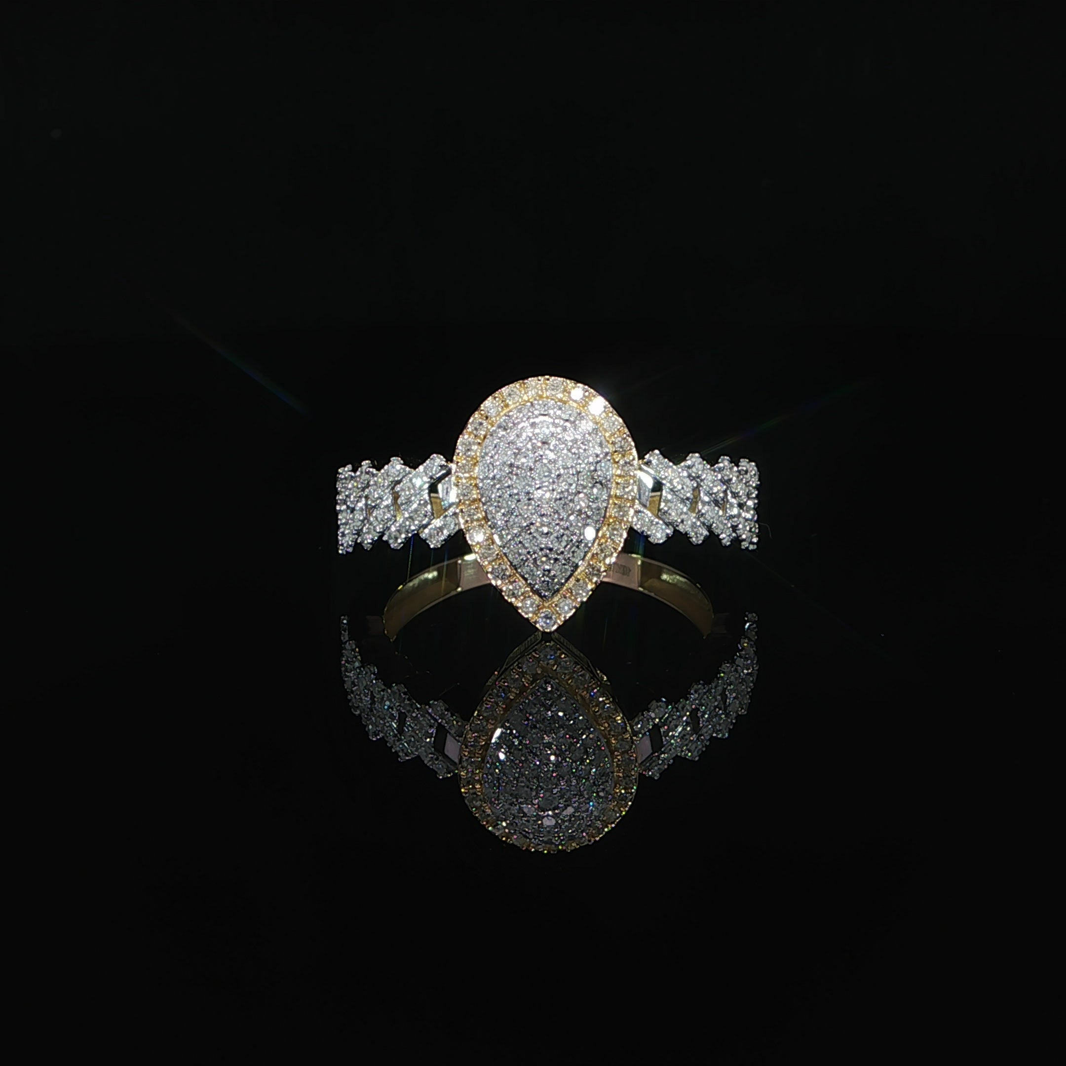 Natural diamond pear-shaped cluster ring crafted in 10K yellow gold