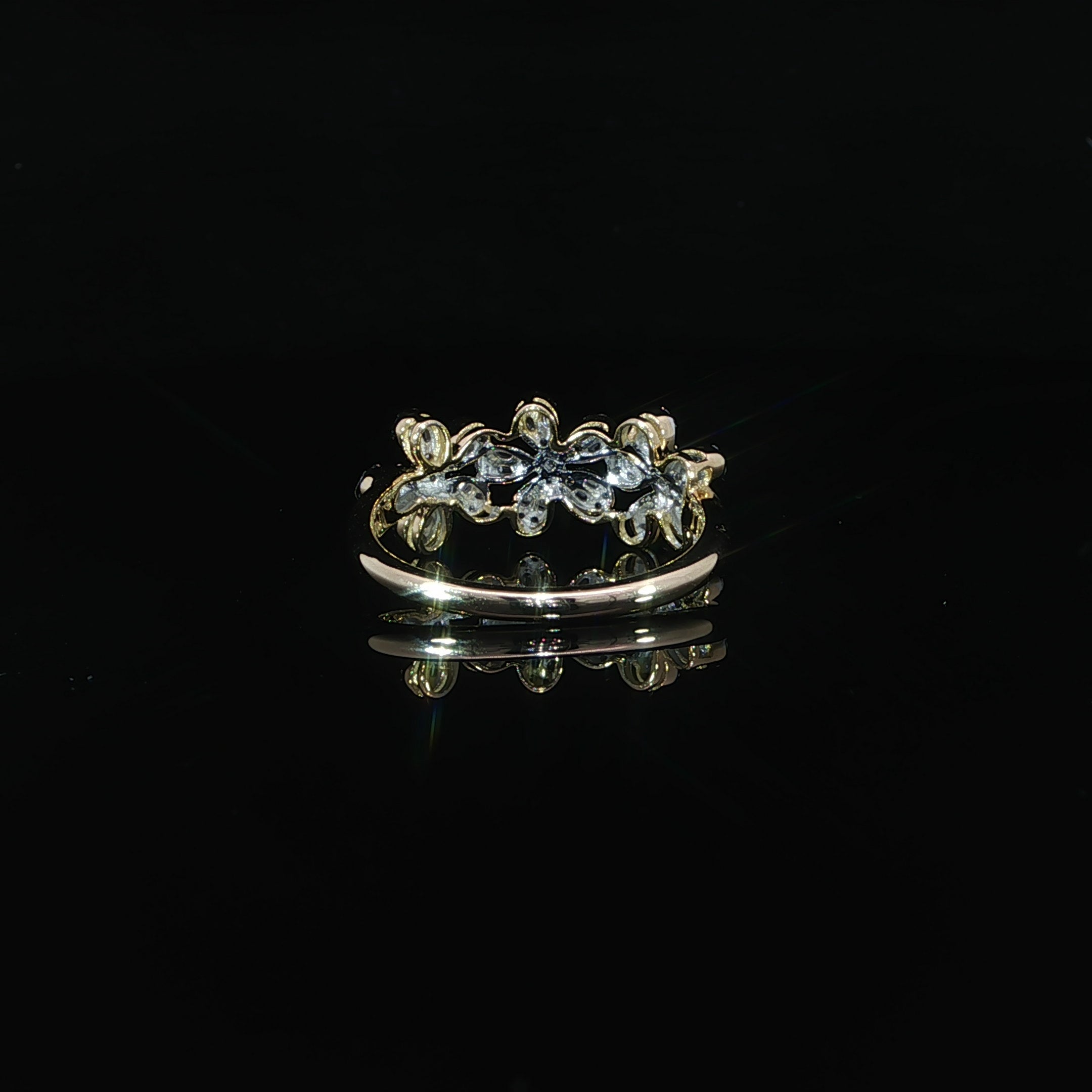 10K yellow gold floral statement ring with three natural diamond flowers