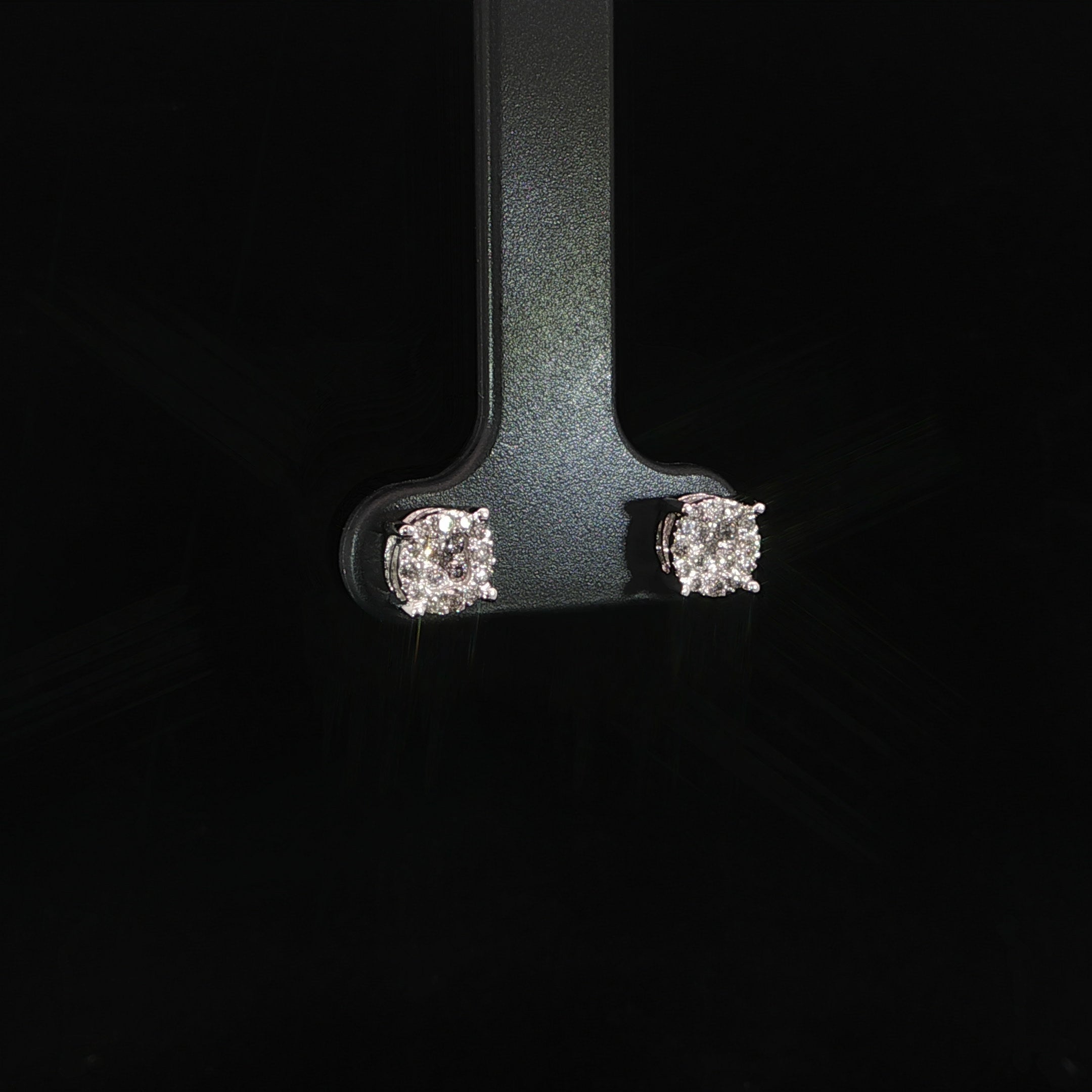 Angled view of natural diamond cluster studs in white gold