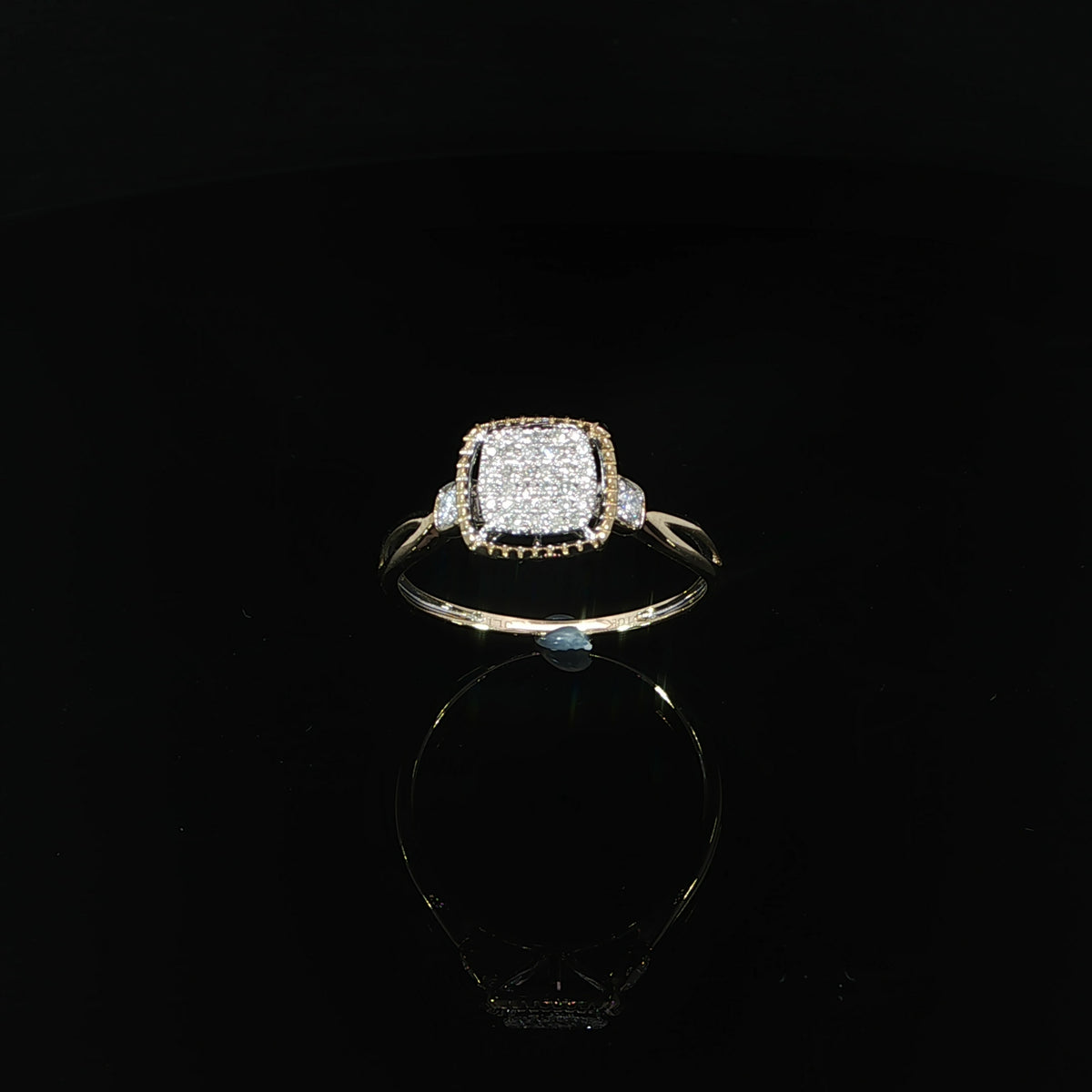 Front angle of a 10K yellow gold cushion-shaped cluster ring with 0.12 CTW of natural diamonds.