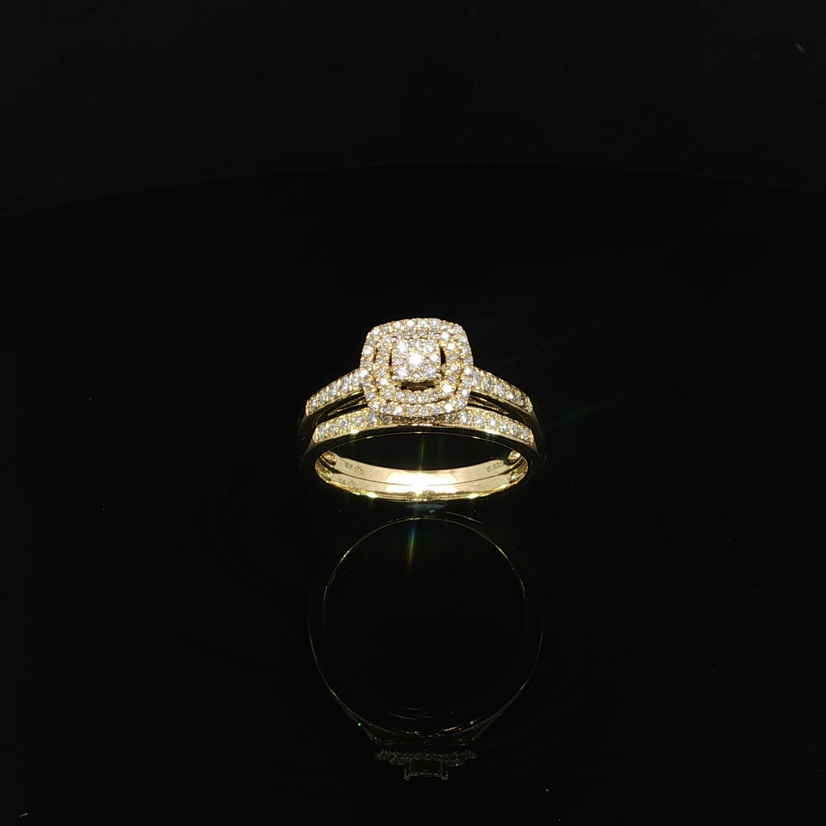 Front view of a 10K yellow gold wedding set with a square diamond cluster, double halo, and matching band, totaling 0.33 CTW.