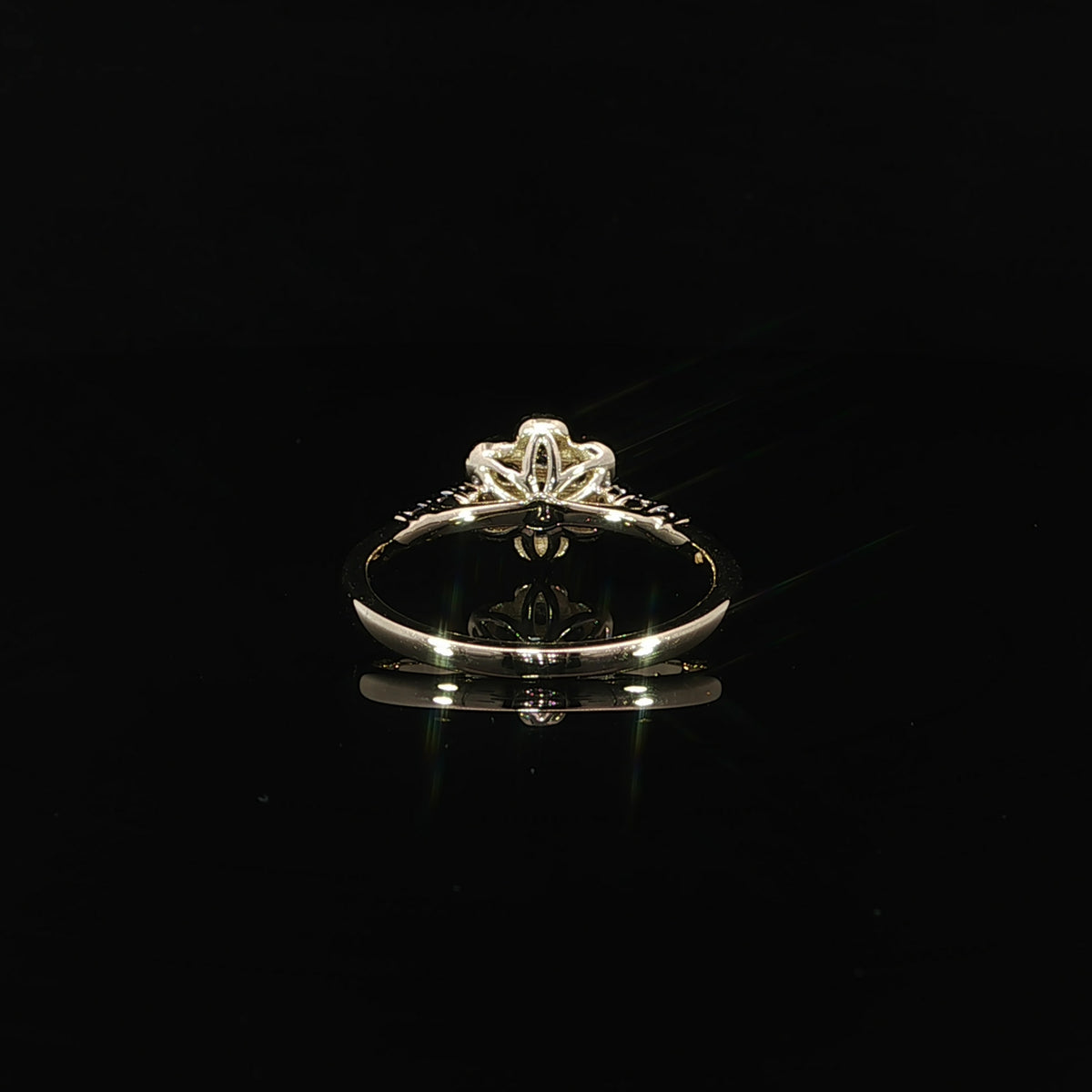 Rear view of a 10K yellow gold 0.14 CTW diamond flower promise ring showing the open petal-shaped gallery.