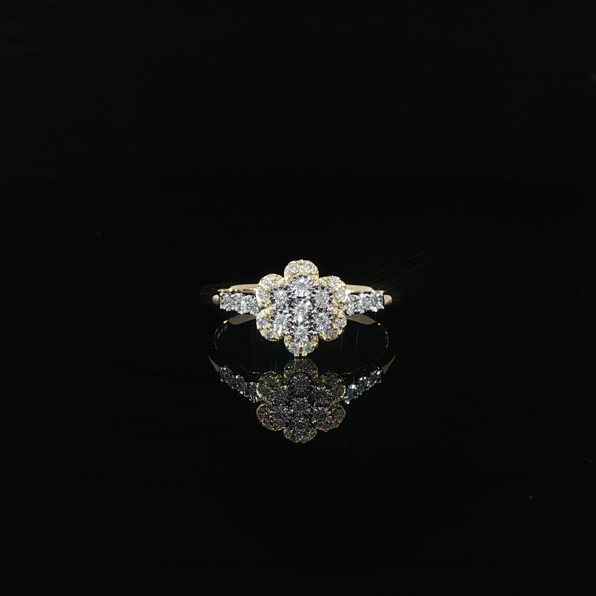 Front view of a 10K yellow gold 0.14 CTW natural diamond flower promise ring with diamond-set shoulders.