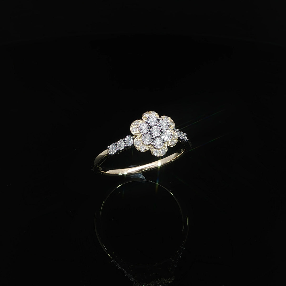 Front view of a 10K yellow gold 0.14 CTW promise ring with round diamonds arranged in a flower design.