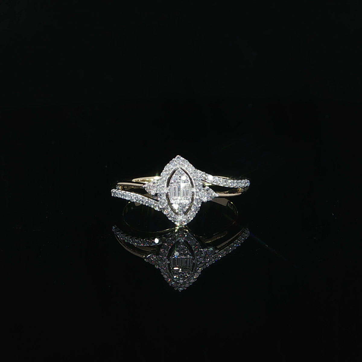 Front view of a 10K yellow gold 0.29 CTW marquise-shaped illusion diamond ring with a surrounding halo.
