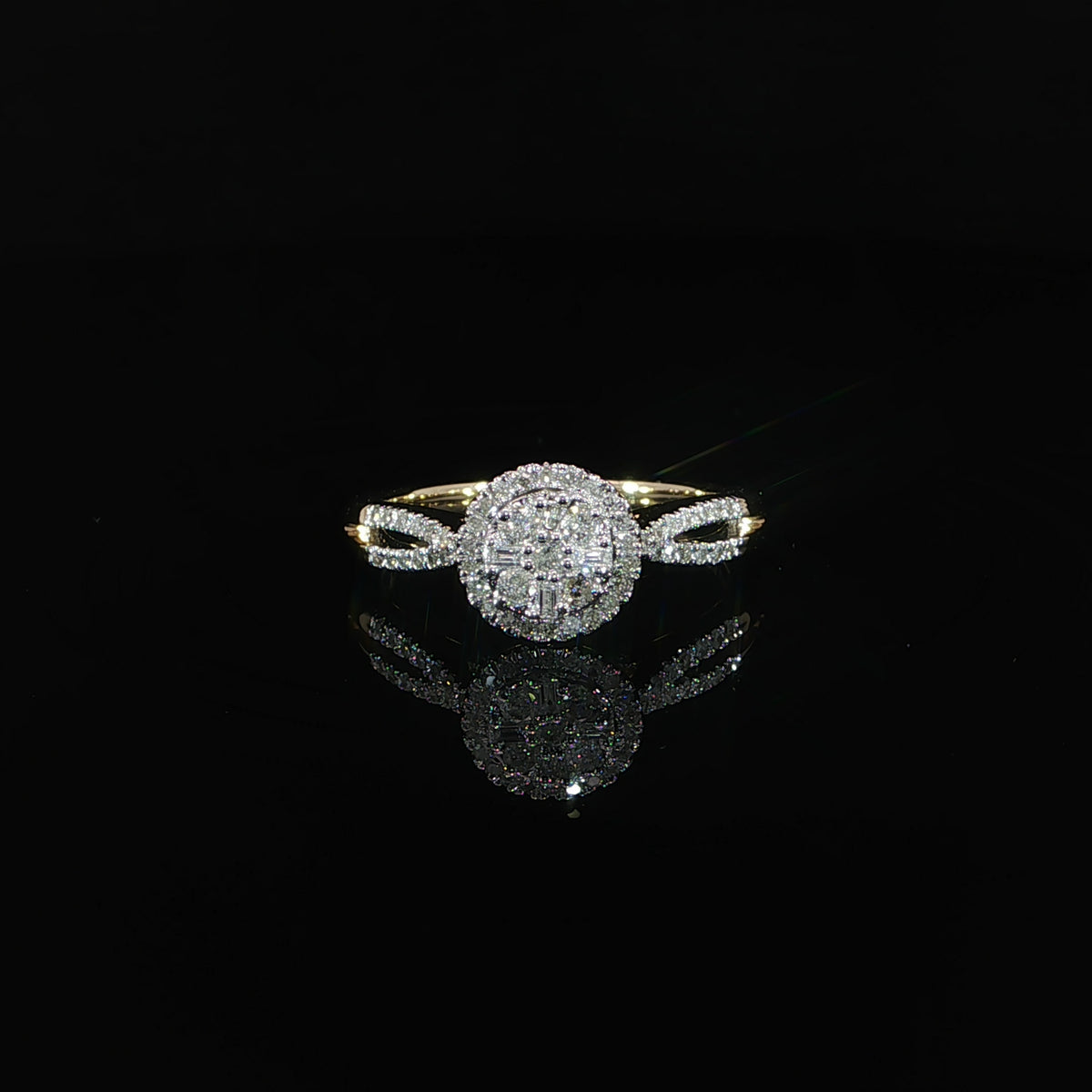 Front view of a 10K yellow gold 0.40 CTW round diamond cluster halo ring with a split shank.