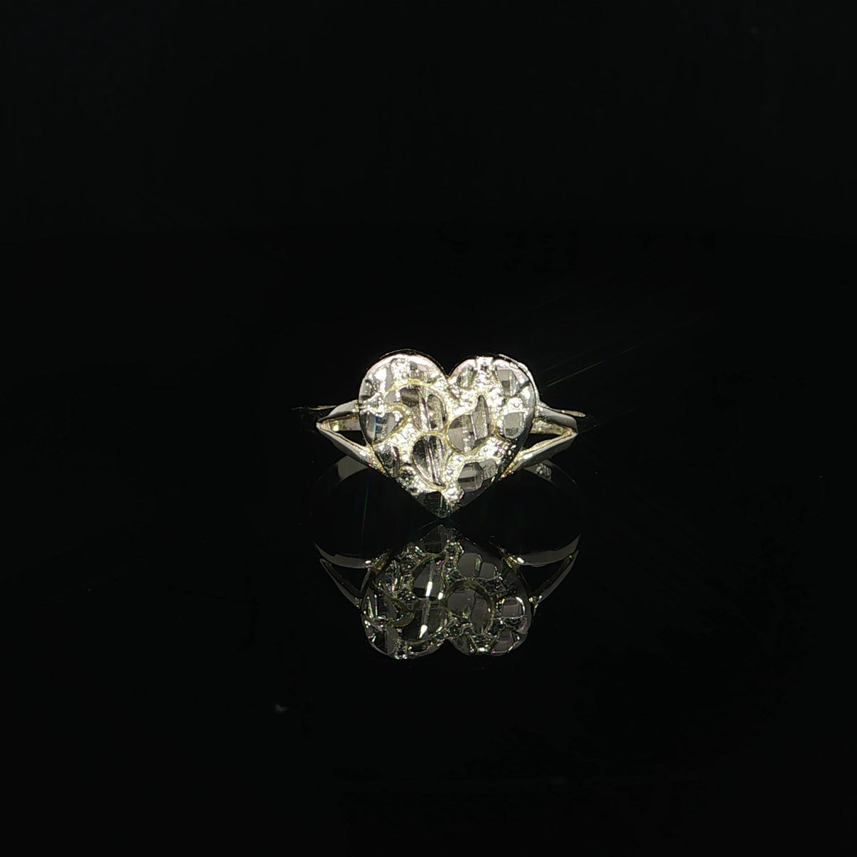 Front view highlighting the 10mm textured heart face of a yellow gold nugget ring.