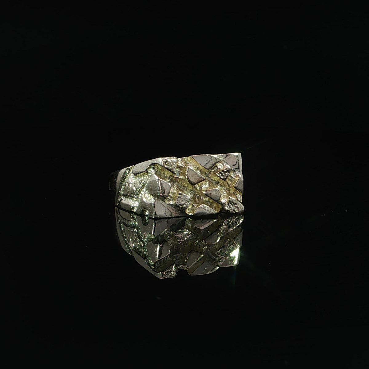 Front view of a 10K yellow gold nugget ring with a 10 mm textured top, reflected on black.