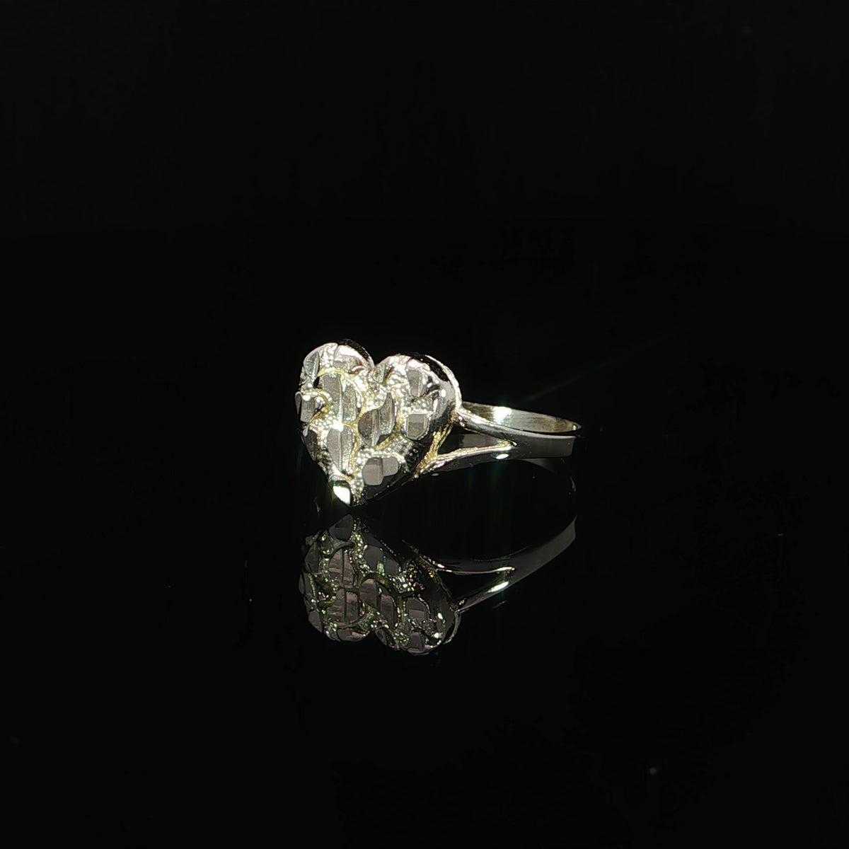 Yellow gold ring featuring a 10mm heart-shaped face with polished nugget details.