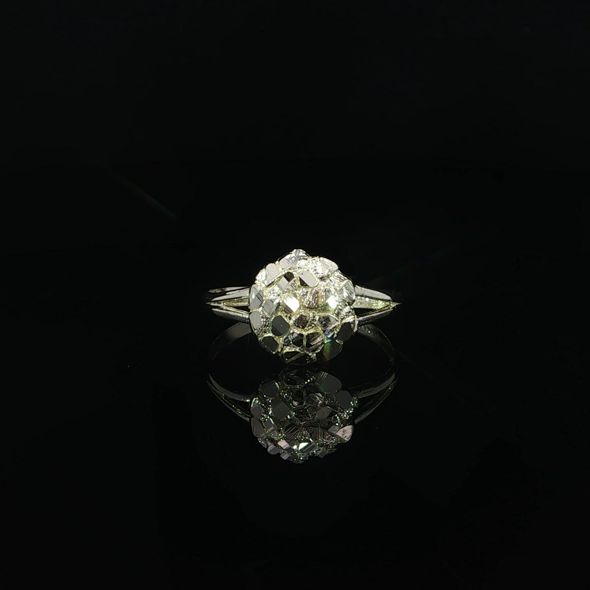 Front view of a 10K yellow gold circle nugget ring with irregular polished facets and split shoulders.