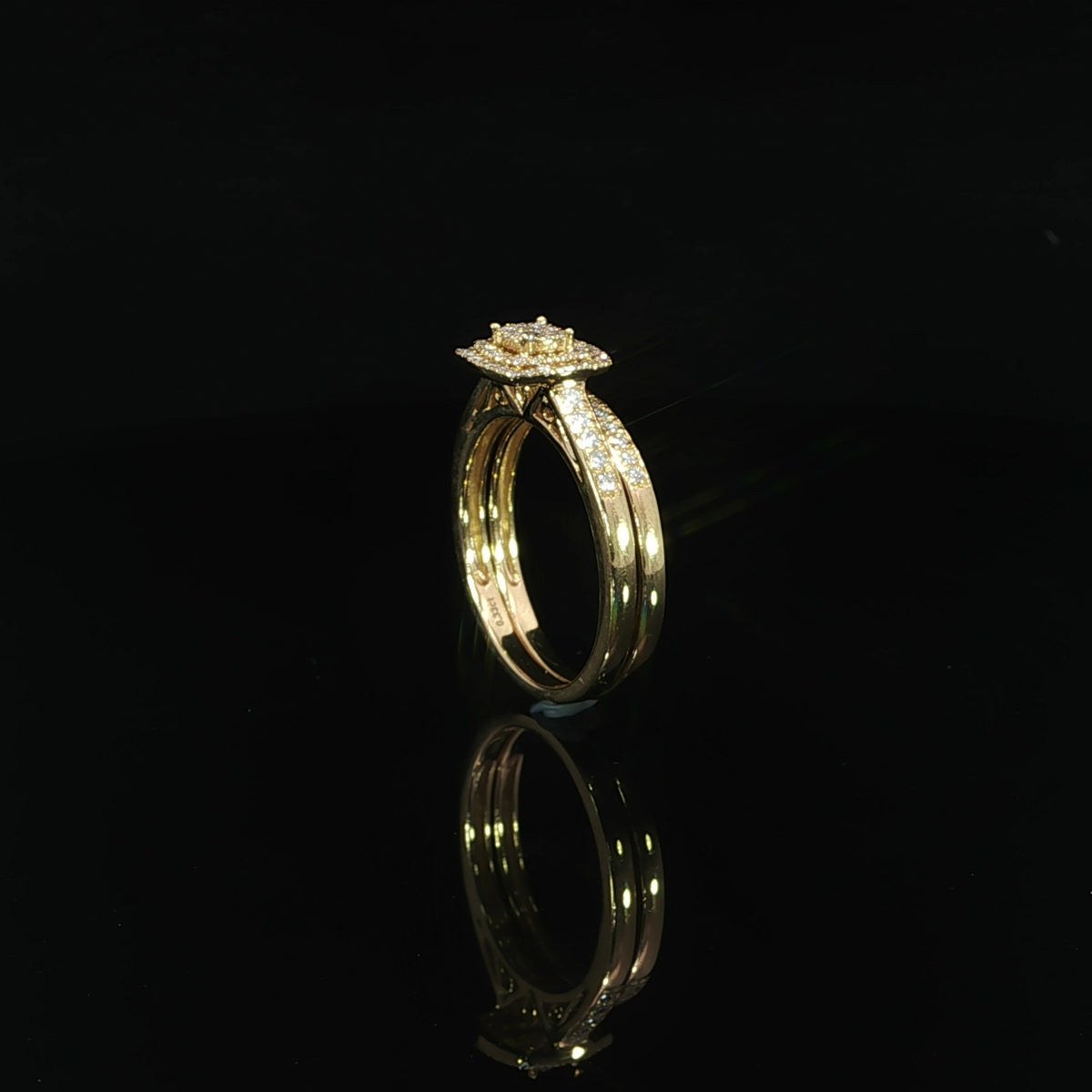 Square cluster wedding set standing at an angle, revealing the polished interiors of both 10K yellow gold rings.