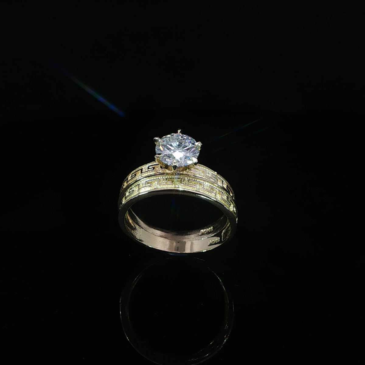 Front view of matching 10K yellow gold Greek key bands with a 1.21 CT lab-grown diamond on the engagement ring.