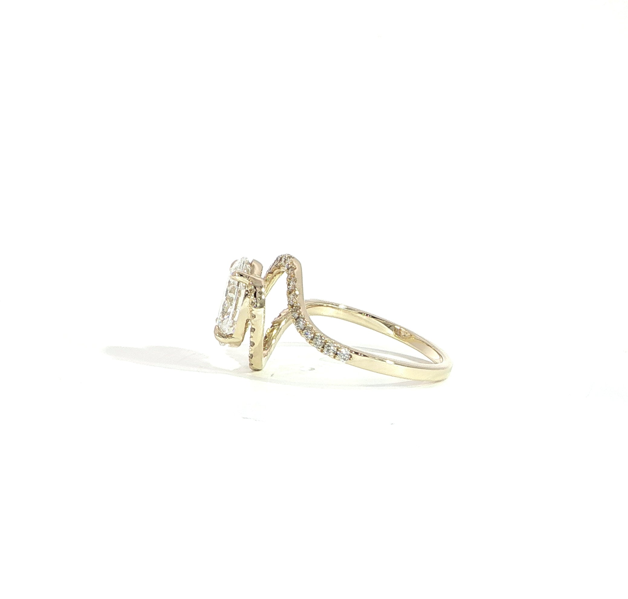 Side view of oval halo diamond ring with bypass setting