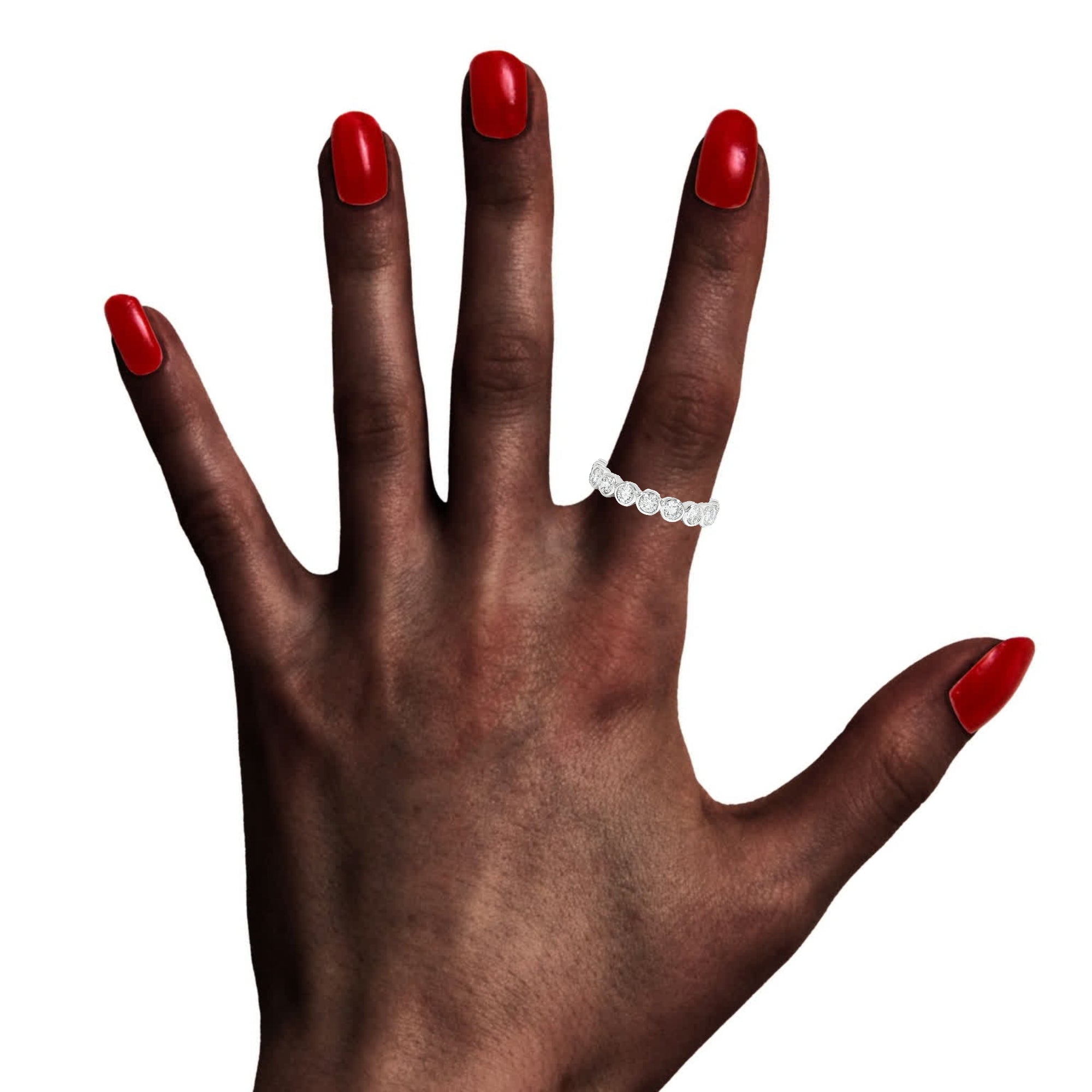 Model wearing 14K gold bezel set diamond band with round lab-grown diamonds