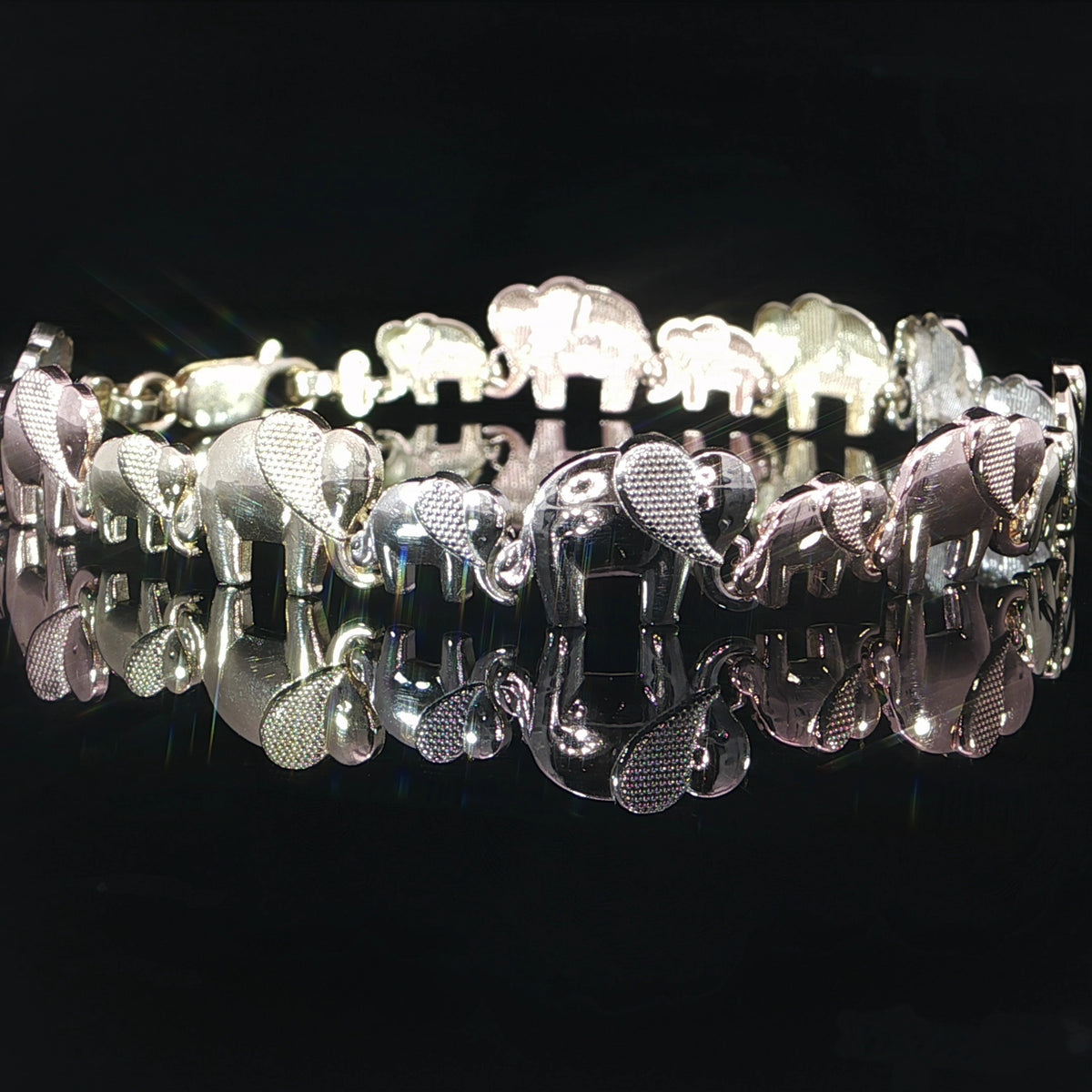9mm elephant bracelet in 14K three-color gold, measuring 7 inches long.