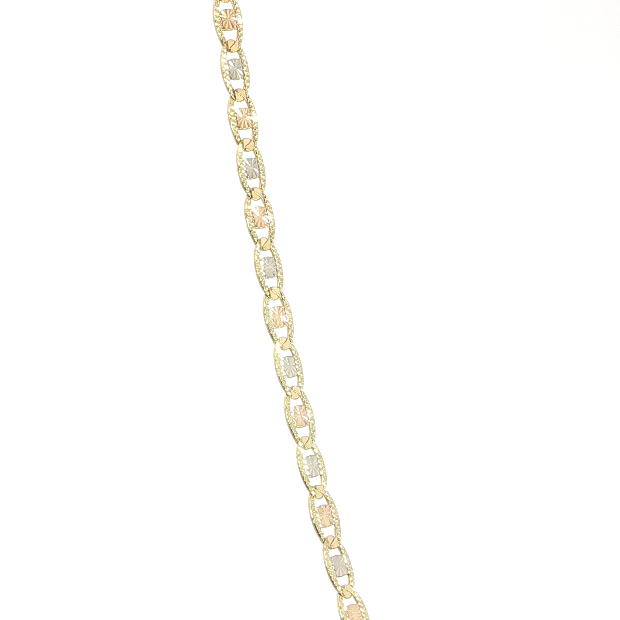 Diamond-cut tri-color flat mariner chain in 14K gold closeup