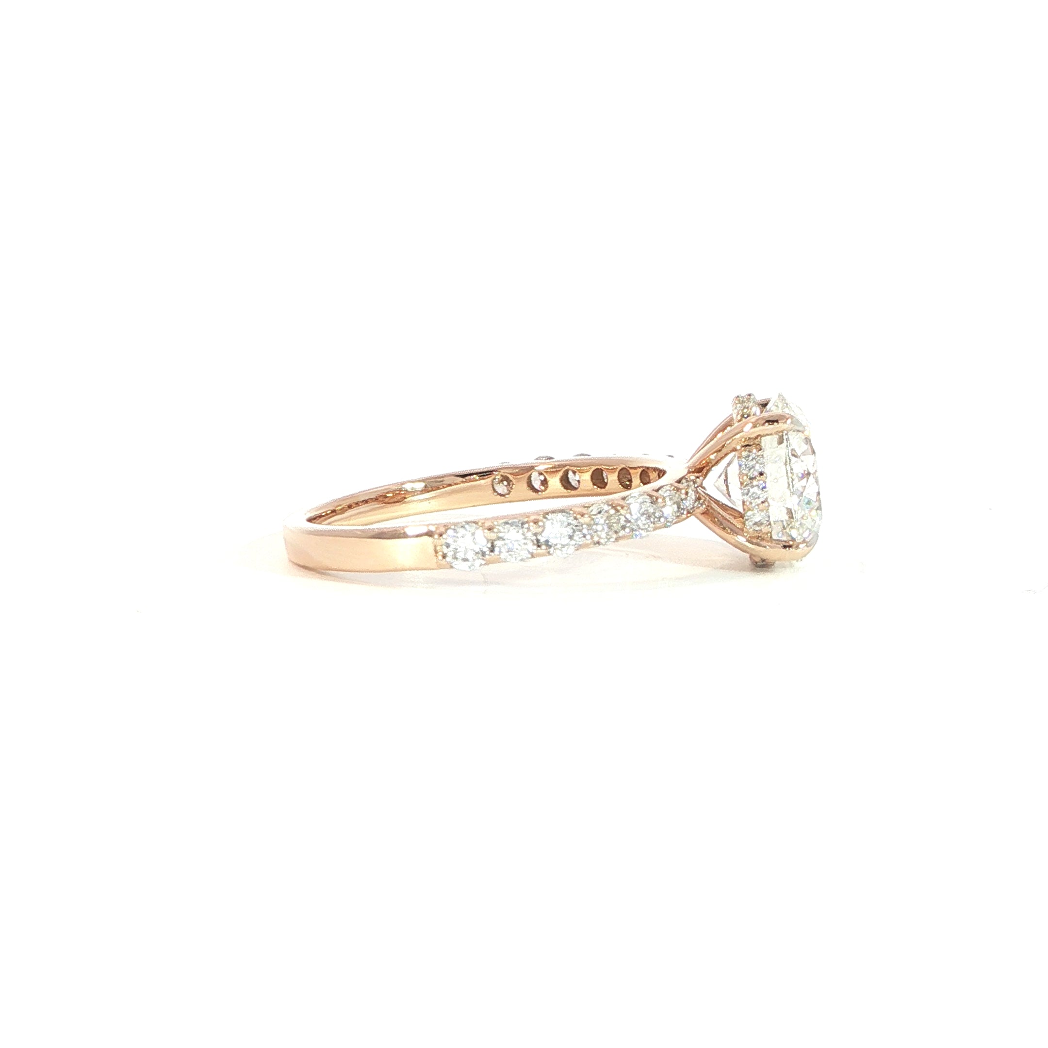 Side view of rose gold solitaire ring showing hidden halo detail
