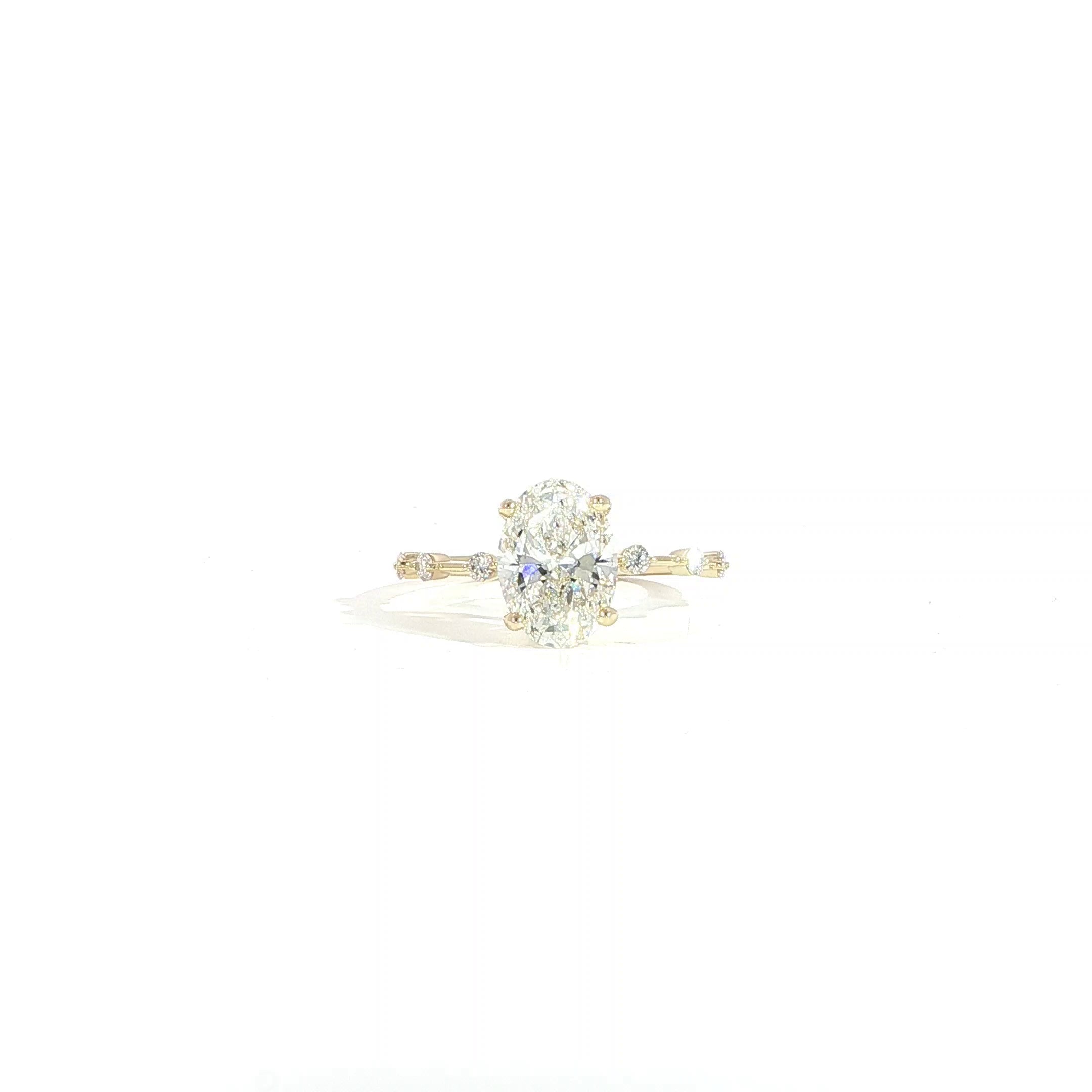 14K gold oval lab diamond engagement ring with 2 CT center and station diamond band