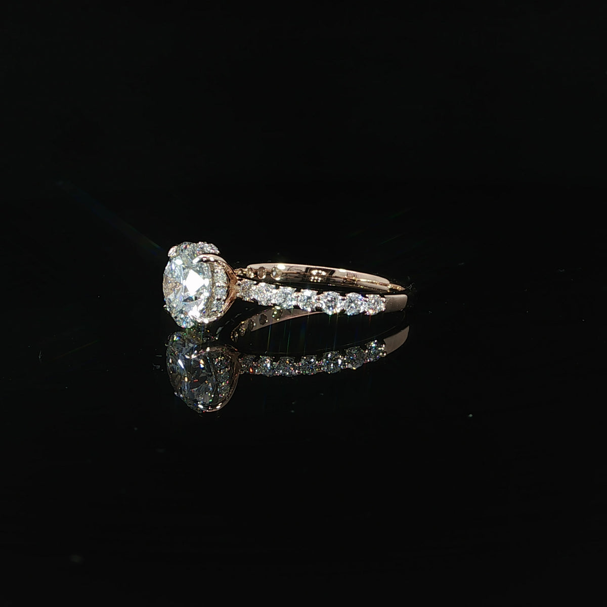 Side profile showing the hidden diamond halo beneath the 2ct round lab-grown center stone.