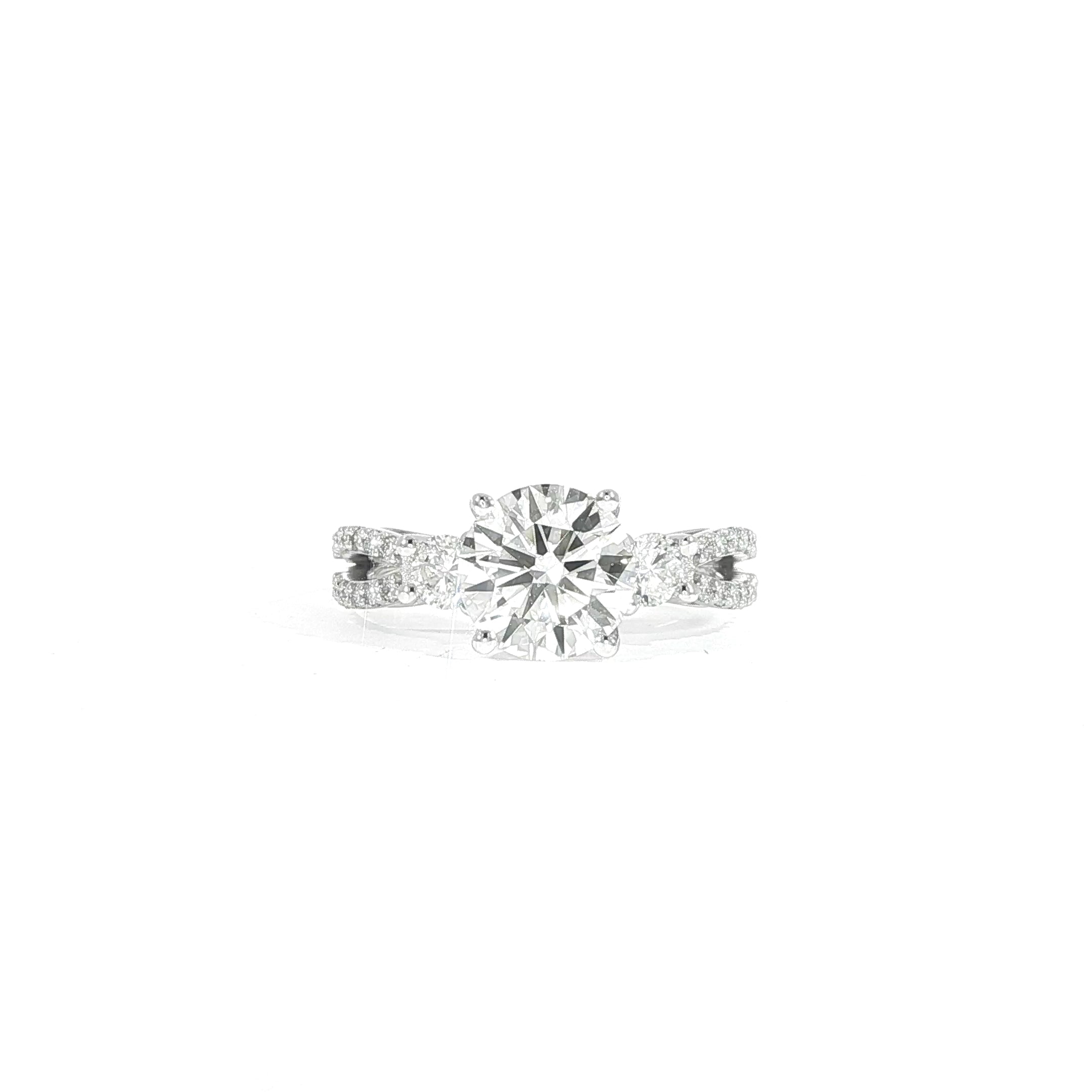 Close-up of round diamond ring with pavé split shank band