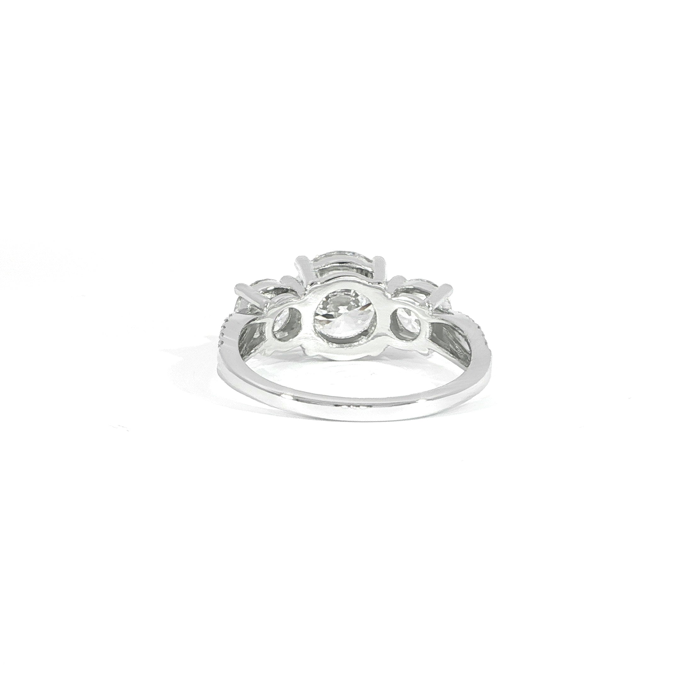 Three stone round diamond engagement ring in 14K white gold with split shank