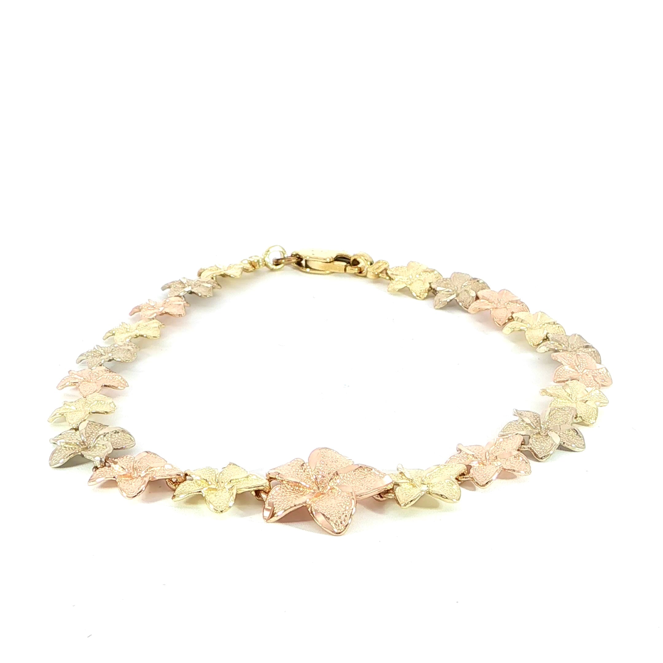 14K tri-color graduated plumeria flower bracelet with diamond-cut edges