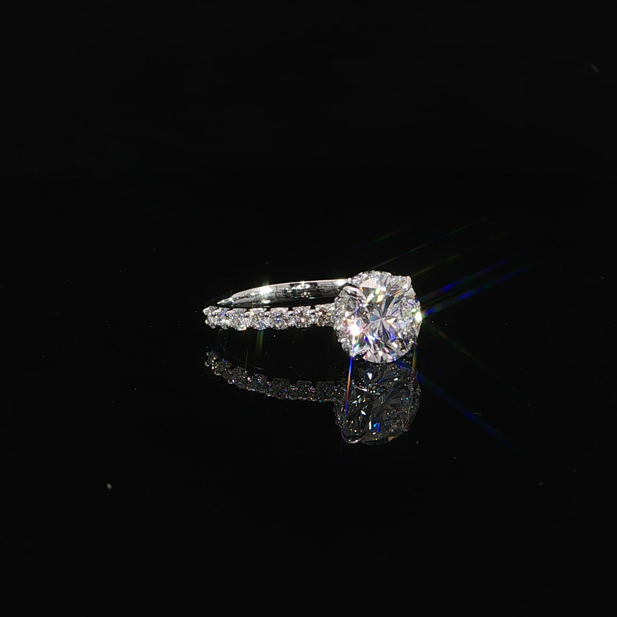 Round engagement ring with 2.55 total carats of lab-grown diamonds set in 14K white gold.