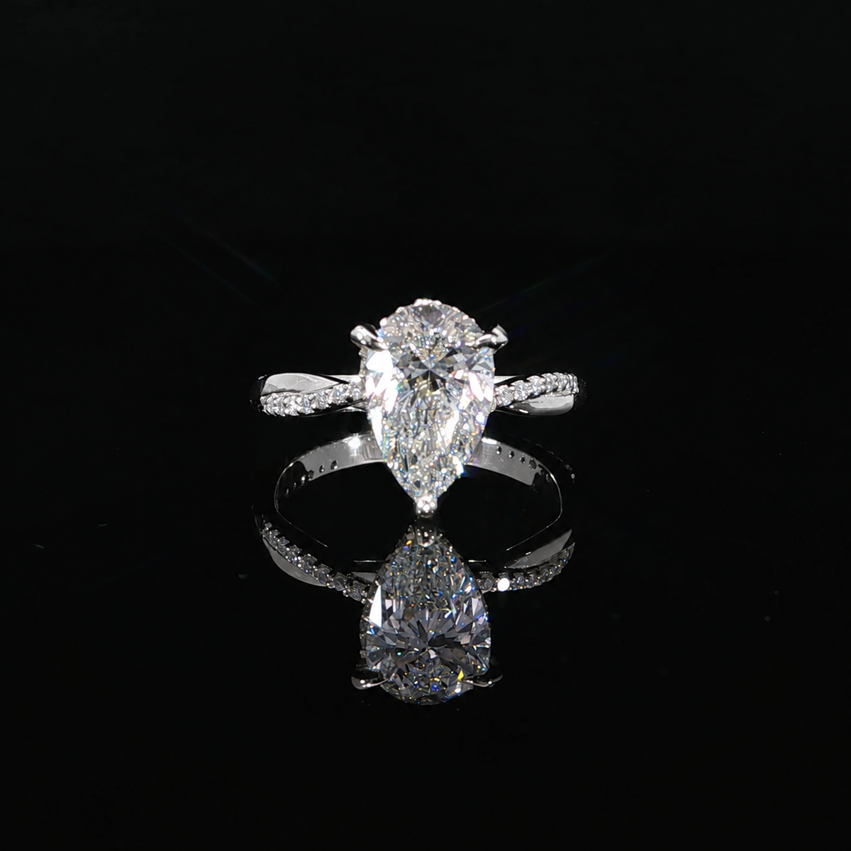 14K white gold pear diamond ring with halo detail and modern twist band