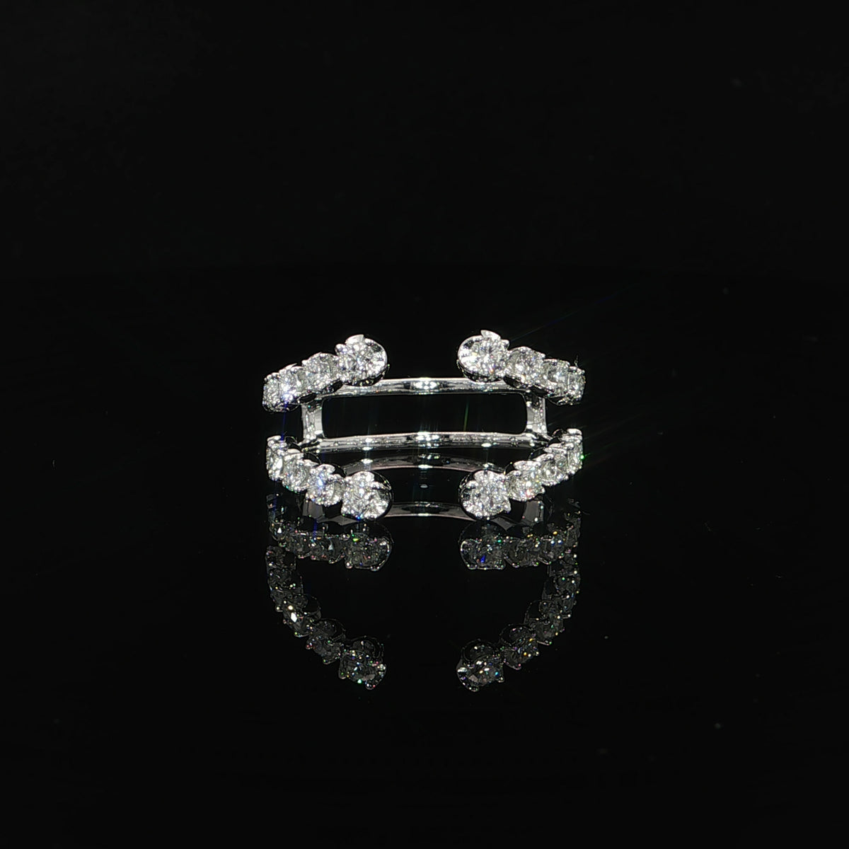 Front view of a 14K white gold enhancer with graduated round lab-grown diamonds and an open double-band design.