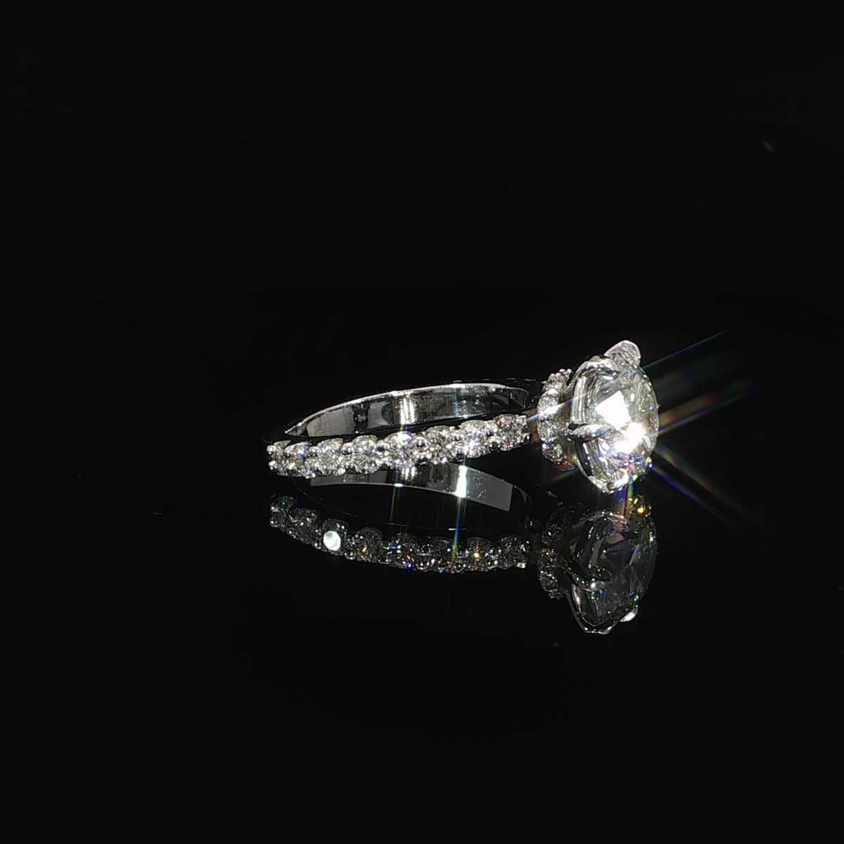 Close-up of the diamond hidden halo beneath the round center stone