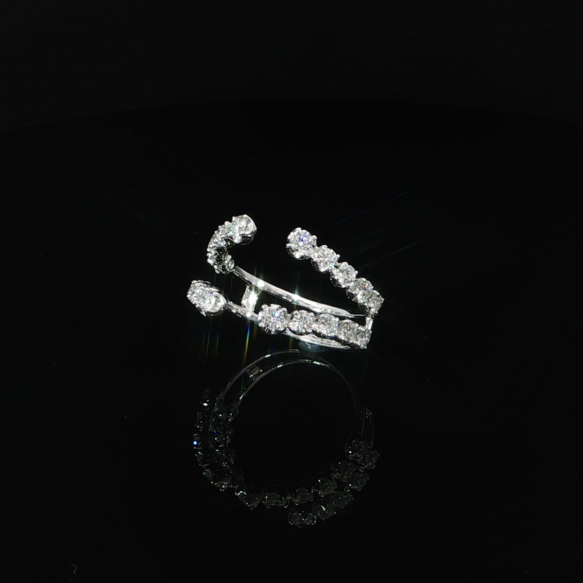 Three-quarter view of a 14K white gold ring enhancer with graduated lab-grown diamonds totaling 0.96 carats.