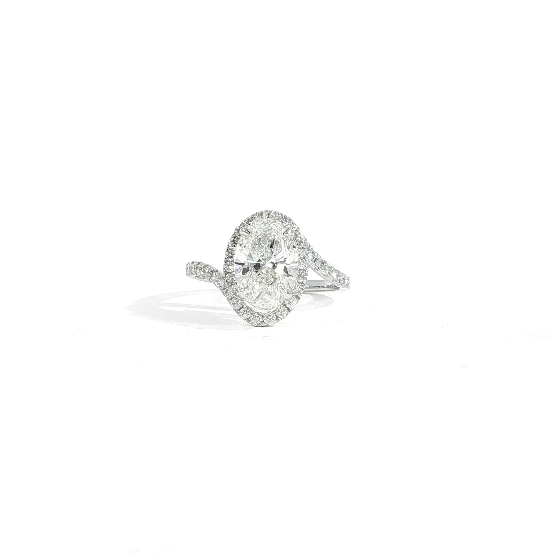 Oval 2 carat lab diamond engagement ring with halo and bypass design