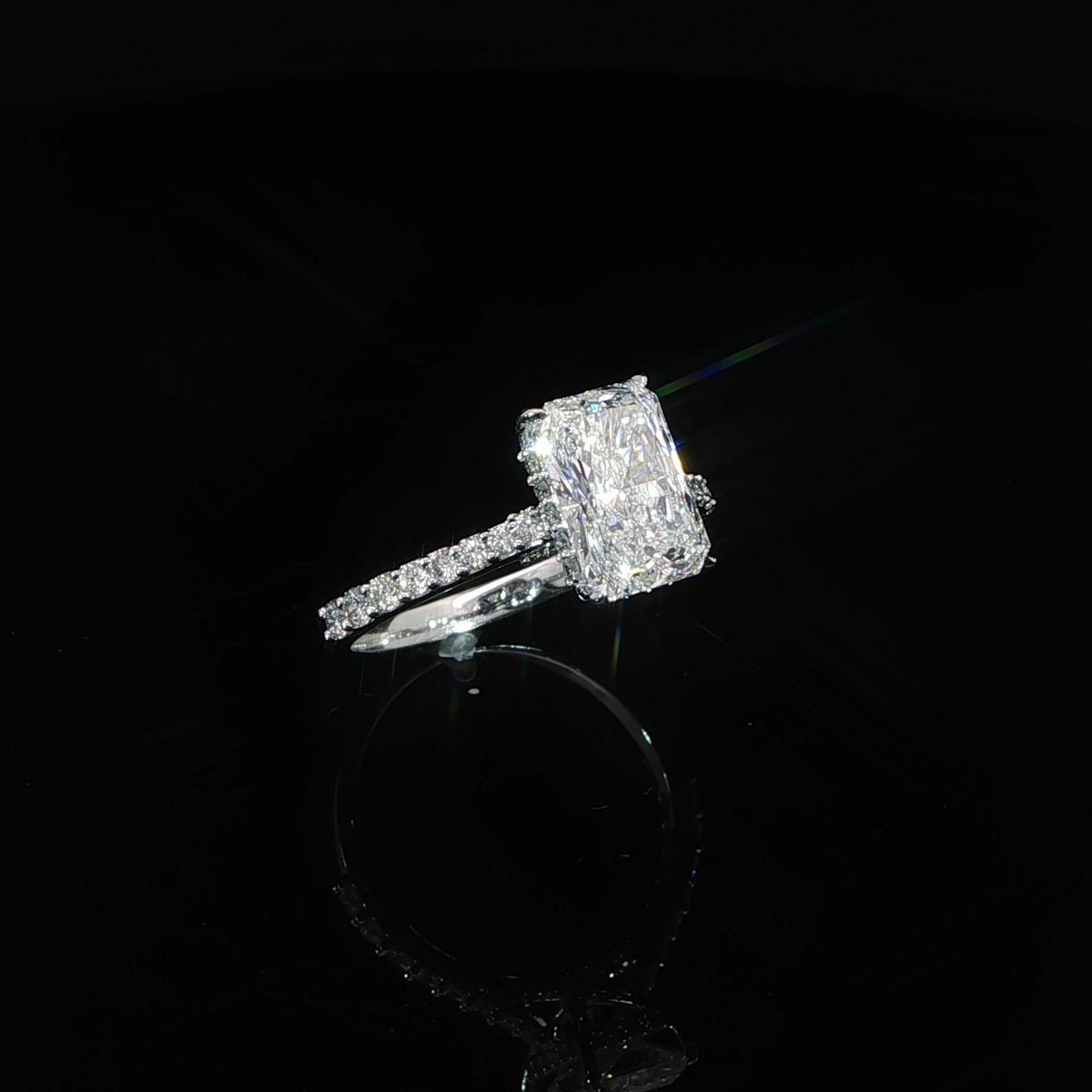 Detailed view of the pavé-set diamonds along the 14K white gold band.