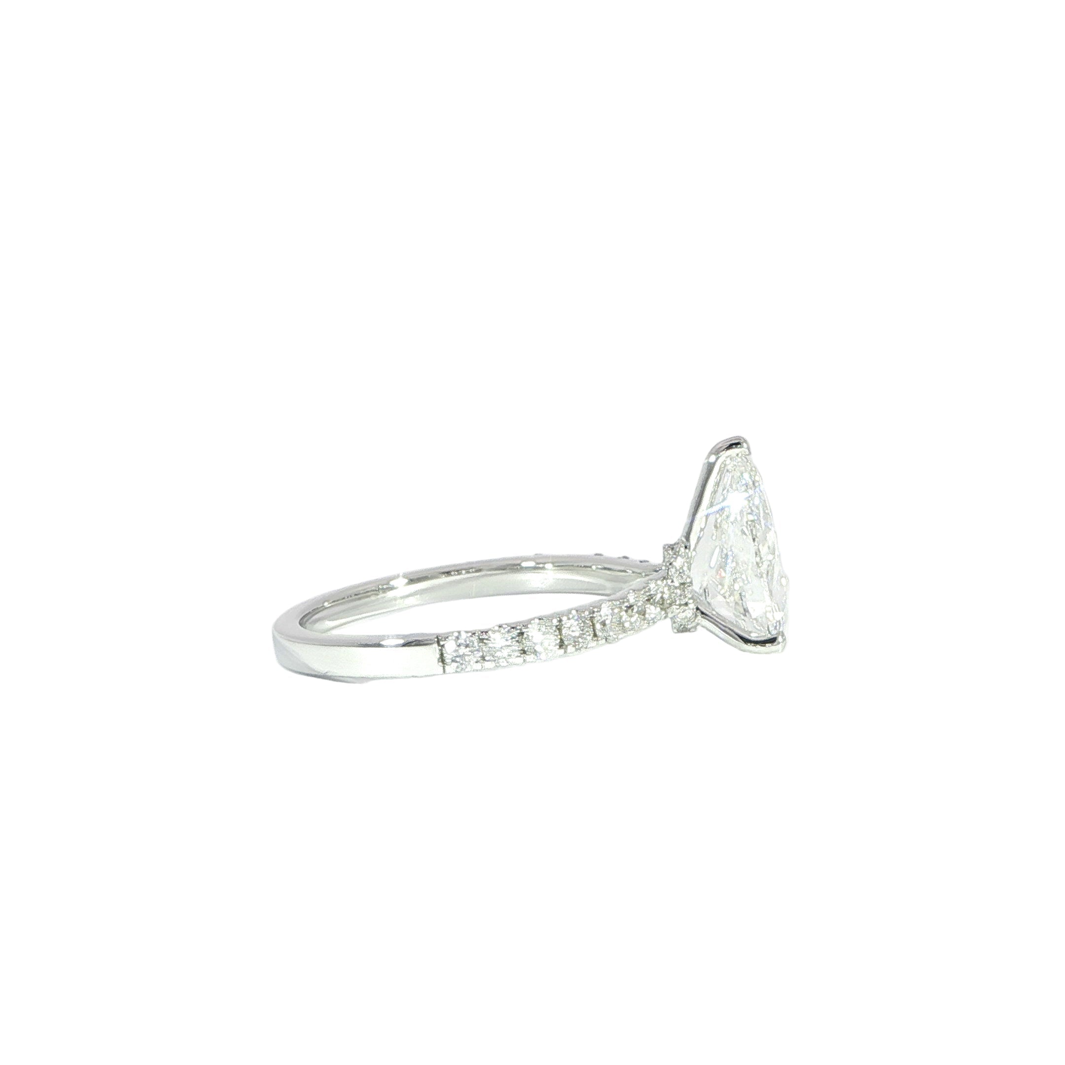 Pear cut solitaire ring with diamond band side
