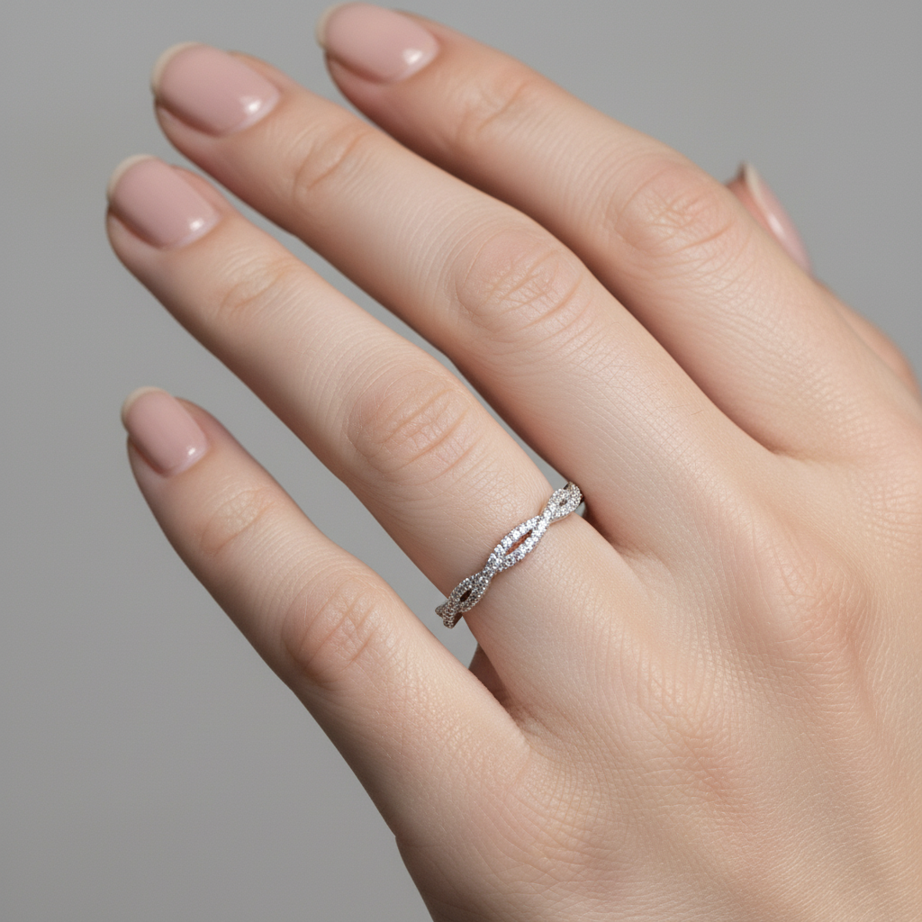 Model wearing twist diamond band in 14K gold with stackable design
