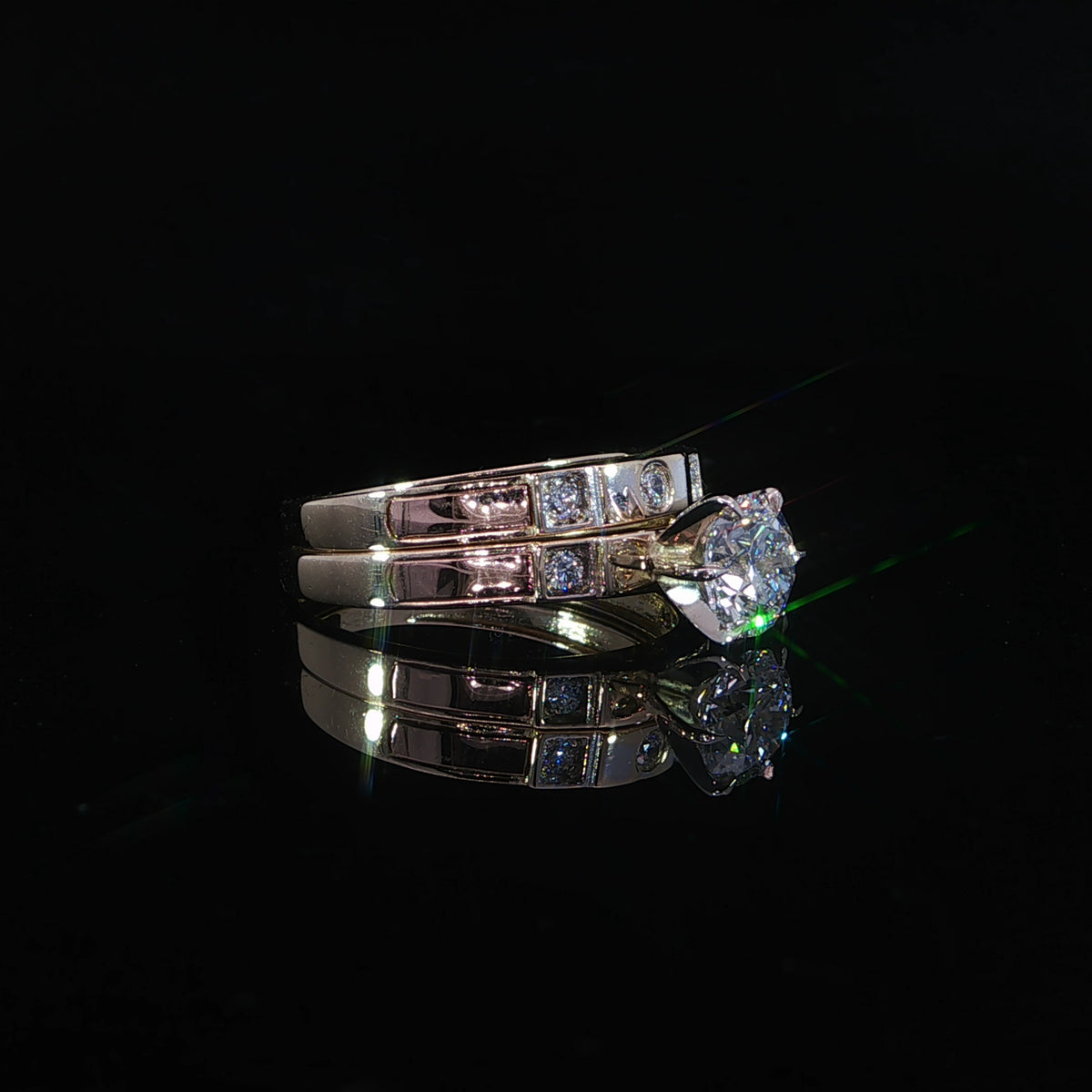 Flat view of a 1.20 CTW lab-grown diamond wedding set with polished gold sections and diamond accents.