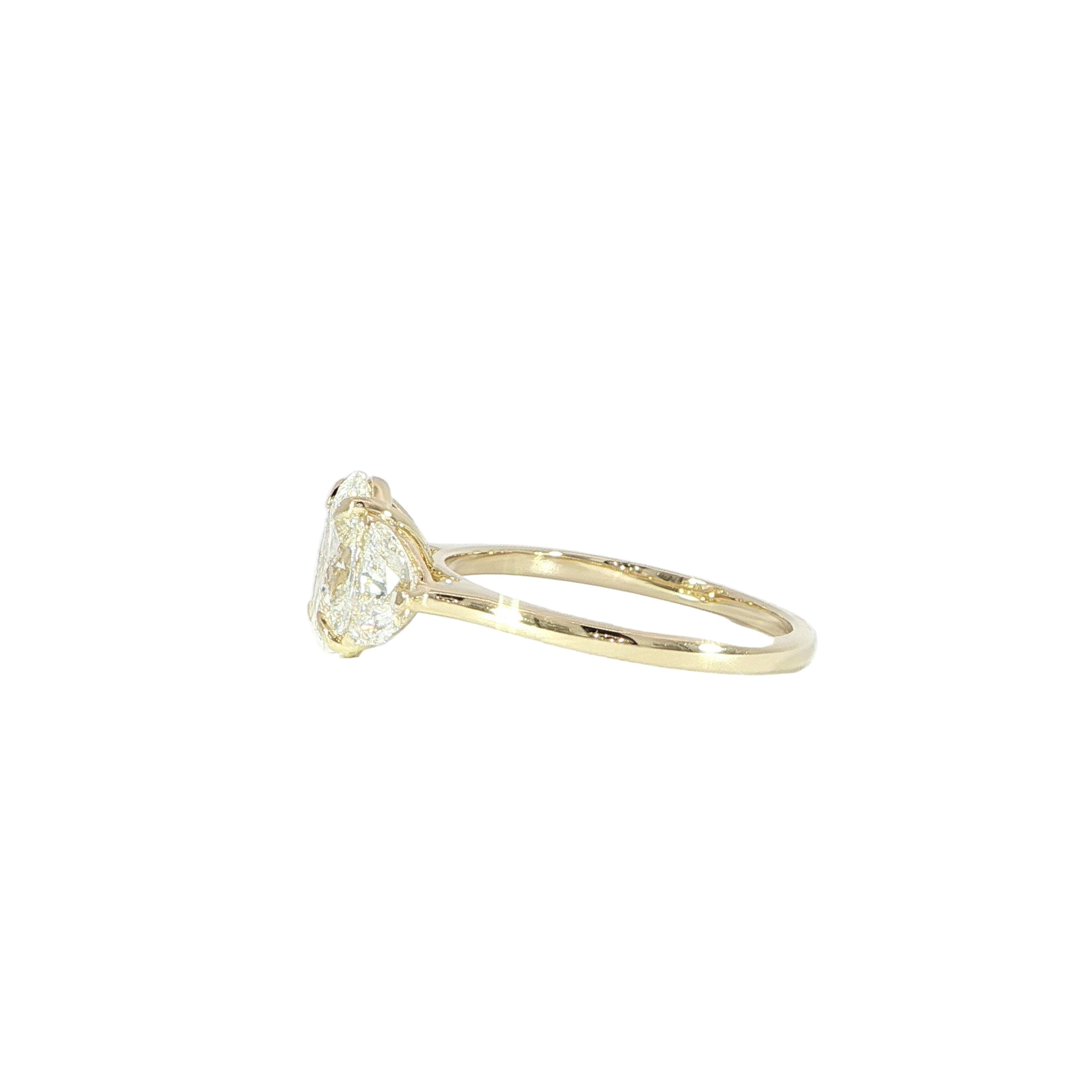 Side view of oval lab diamond ring with half moon diamonds in 14K yellow gold