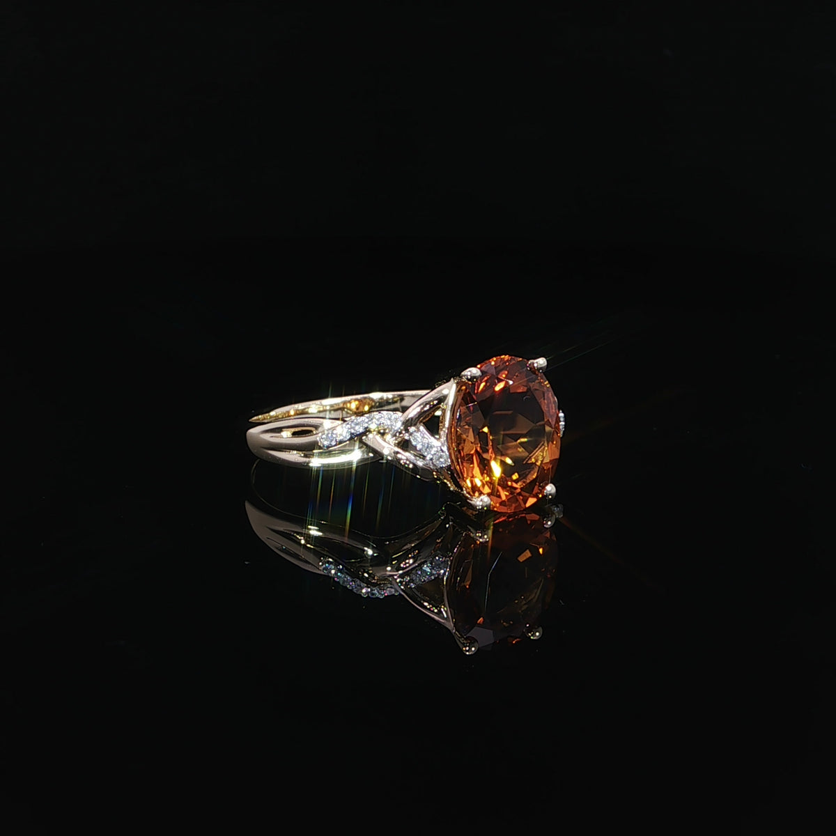 Oval natural citrine ring in 14K yellow gold with 0.06 CTW diamonds, reflected on a black surface.