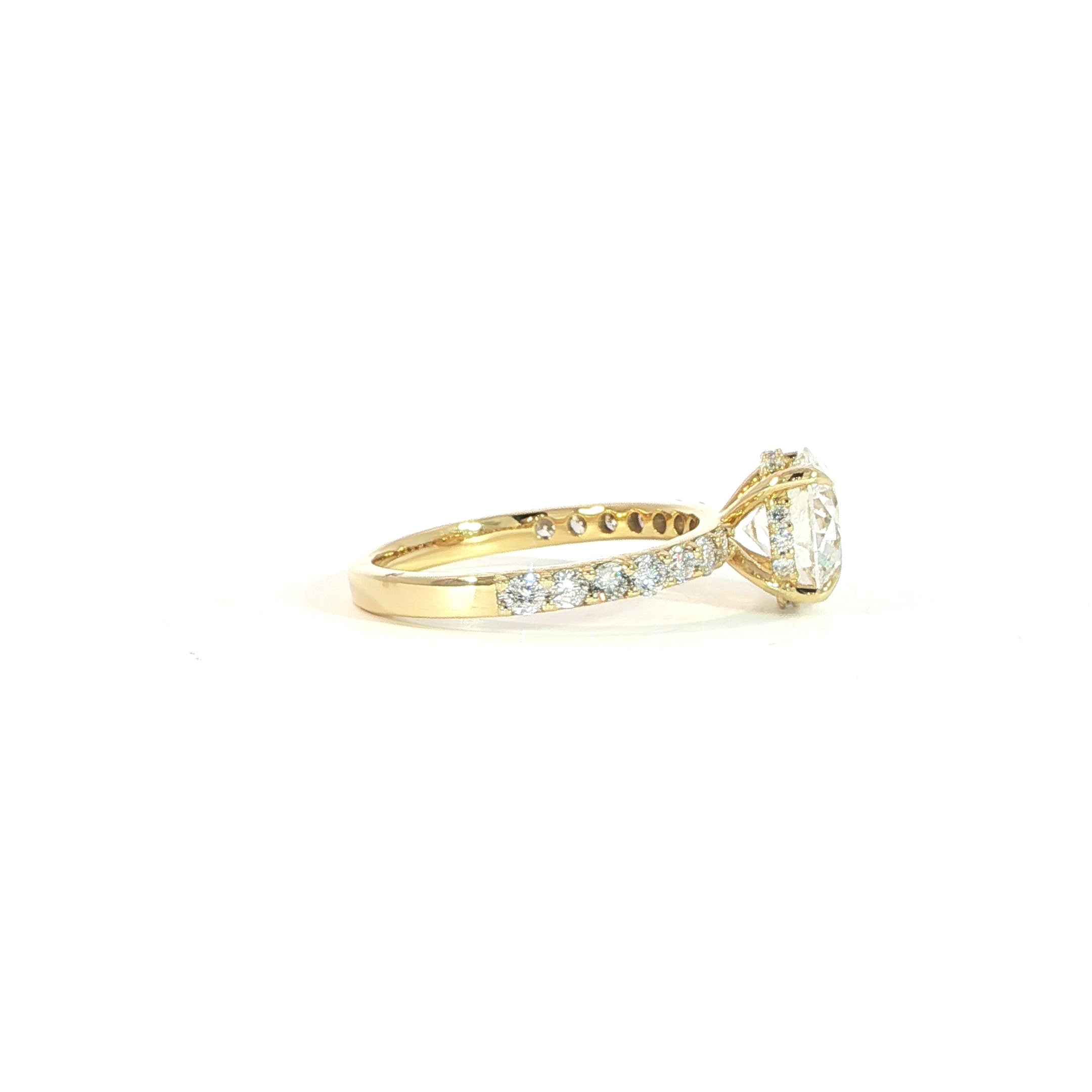 Side view of round solitaire ring showing hidden halo detail