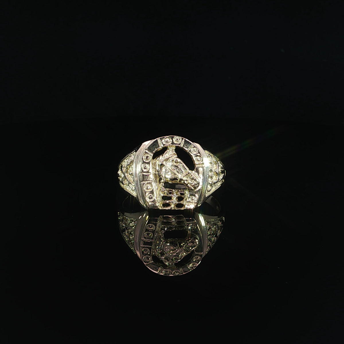 Front view of a 14K yellow gold signet ring with a raised horse head inside an openwork horseshoe.