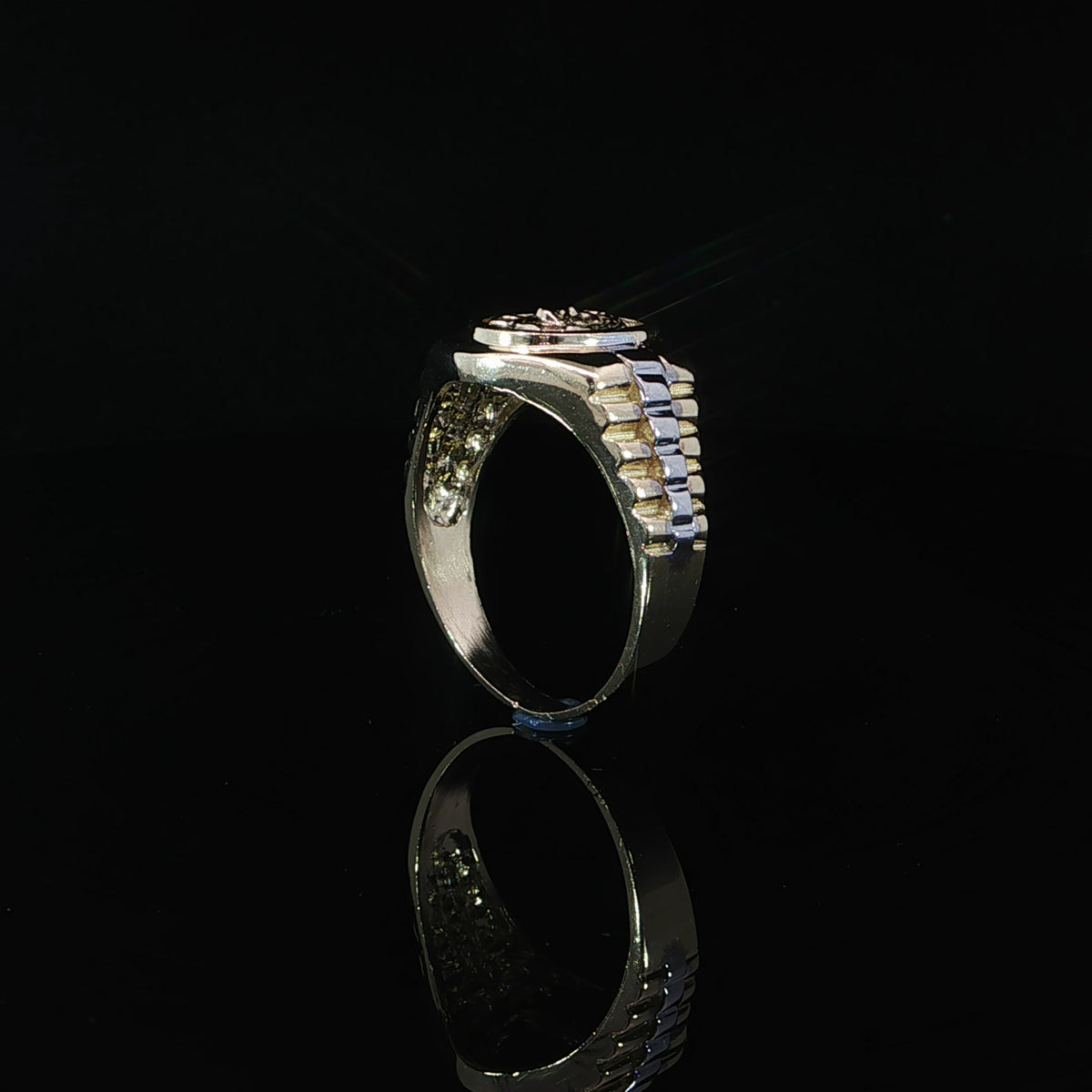 Side profile of a 14K yellow gold Jesus signet ring showing the raised oval setting, stepped two-tone shoulder design, tapered shank, and smooth interior.